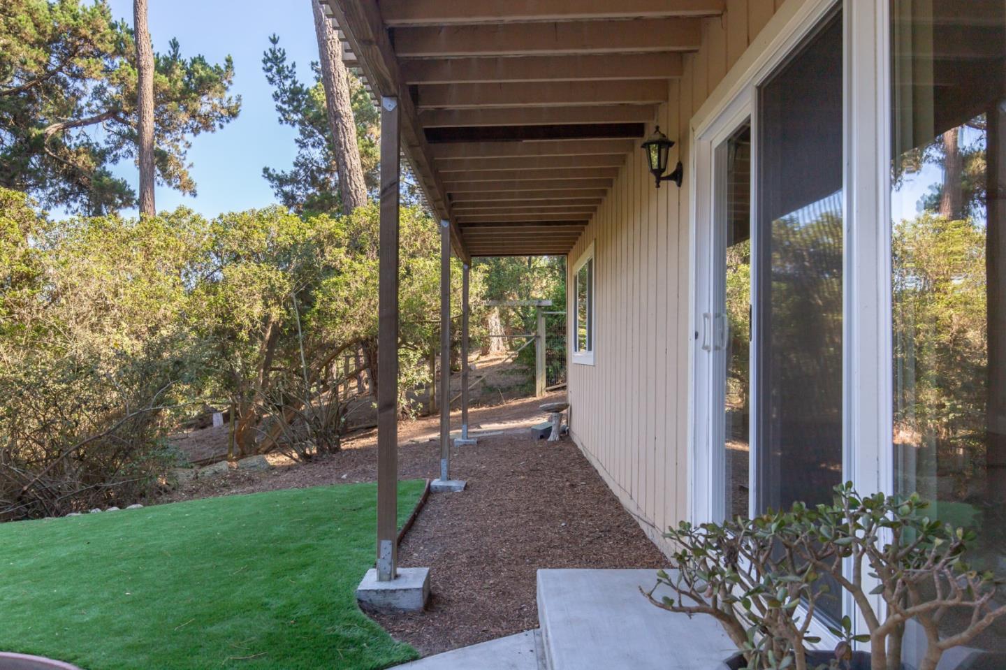 4095 Crest Road Pebble Beach, CA 93953 - Photo 21 of 21 a view of house with backyard and garden
