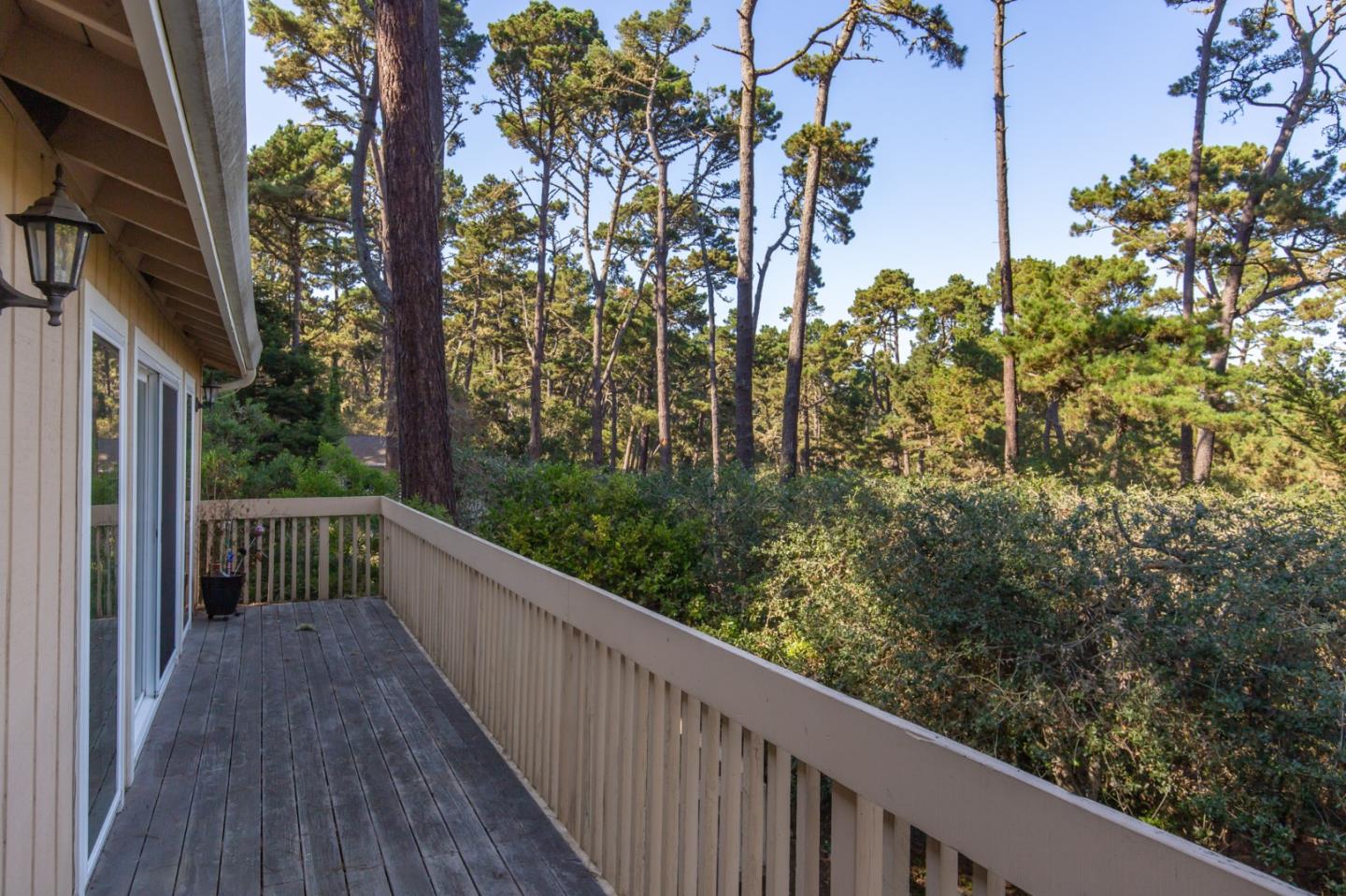 4095 Crest Road Pebble Beach, CA 93953 - Photo 9 of 21 a view of a balcony with wooden fence