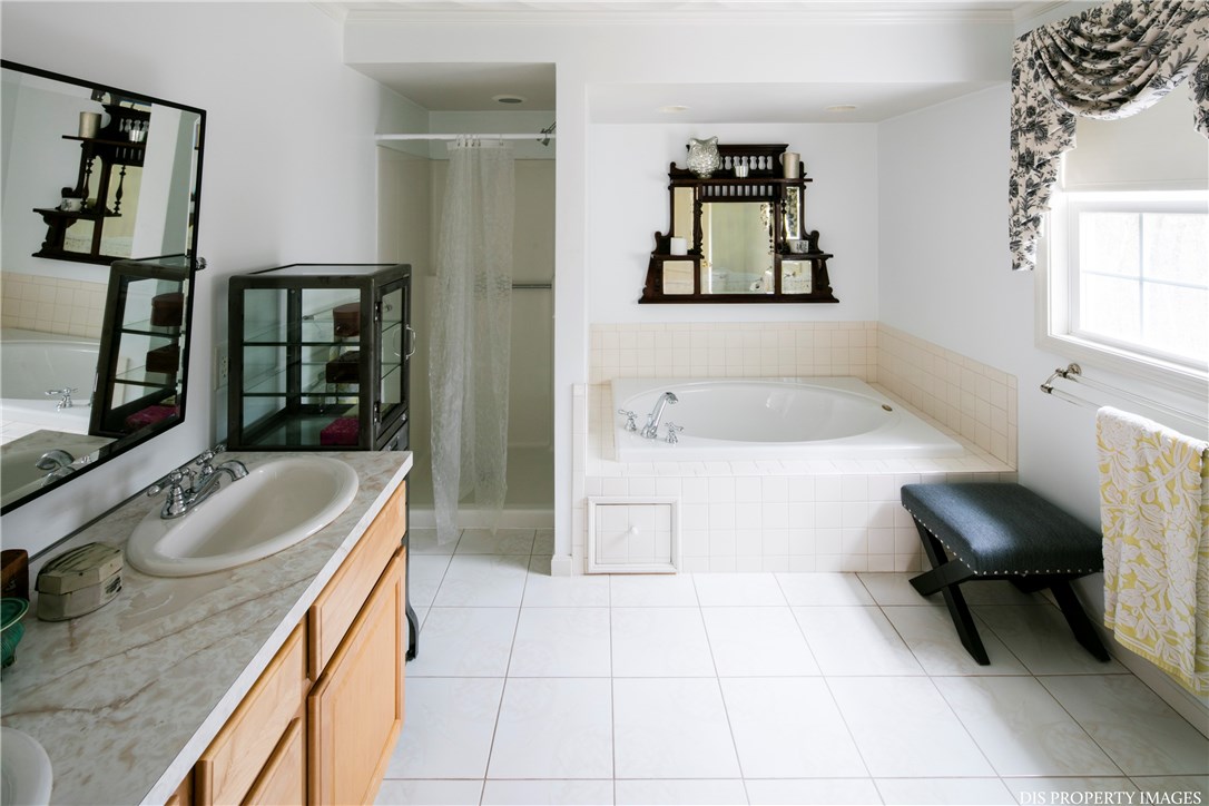 6 Cobblestone Hill Road Exeter, RI 02822 - Photo 23 of 39 Master bedroom bathroom with full Jacuzzi tub and separate shower, two sinks.