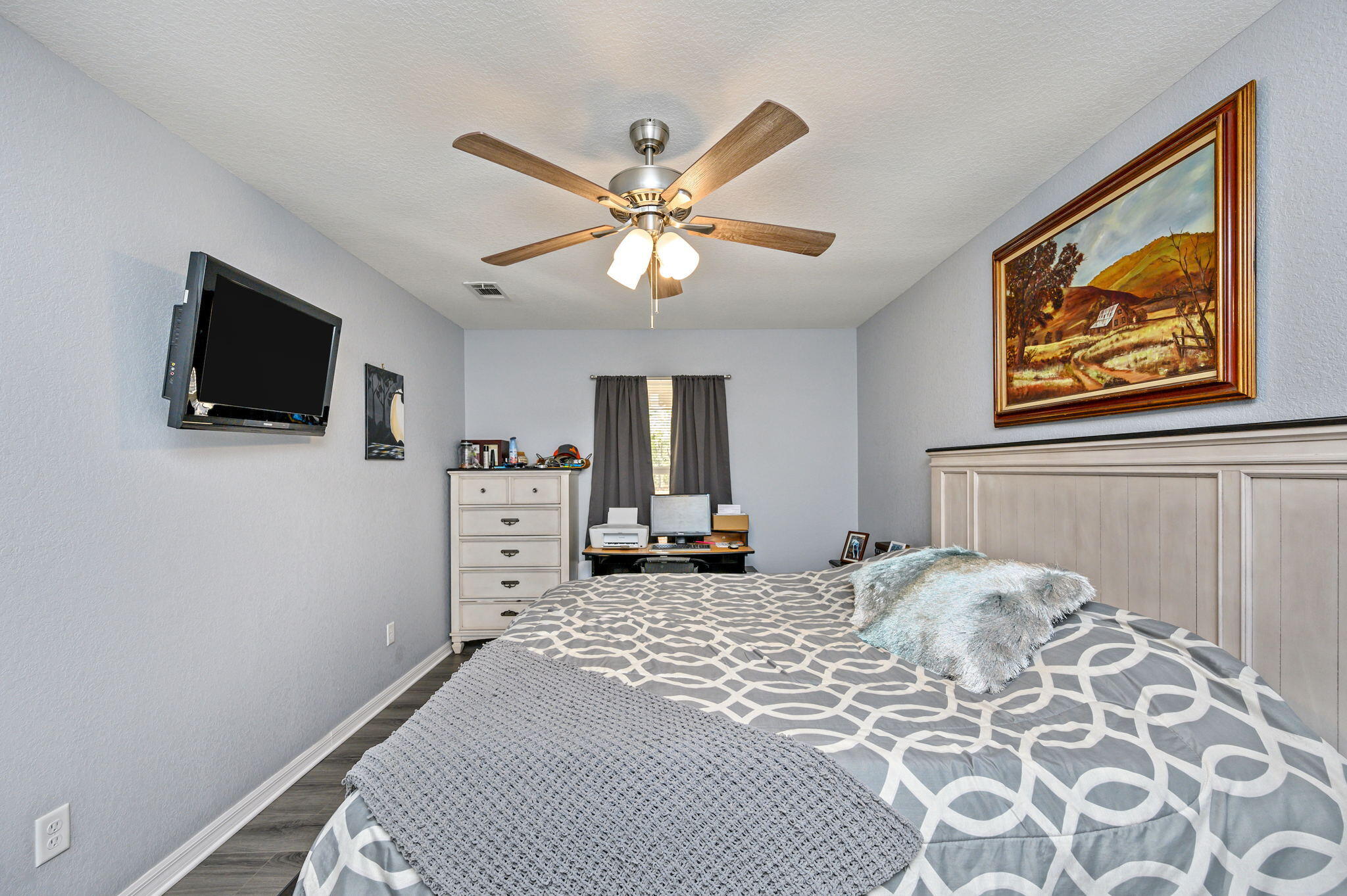 149 Delaware Road DeFuniak Springs, FL 32433 - Photo 15 of 36 a bedroom with a bed and a flat screen tv