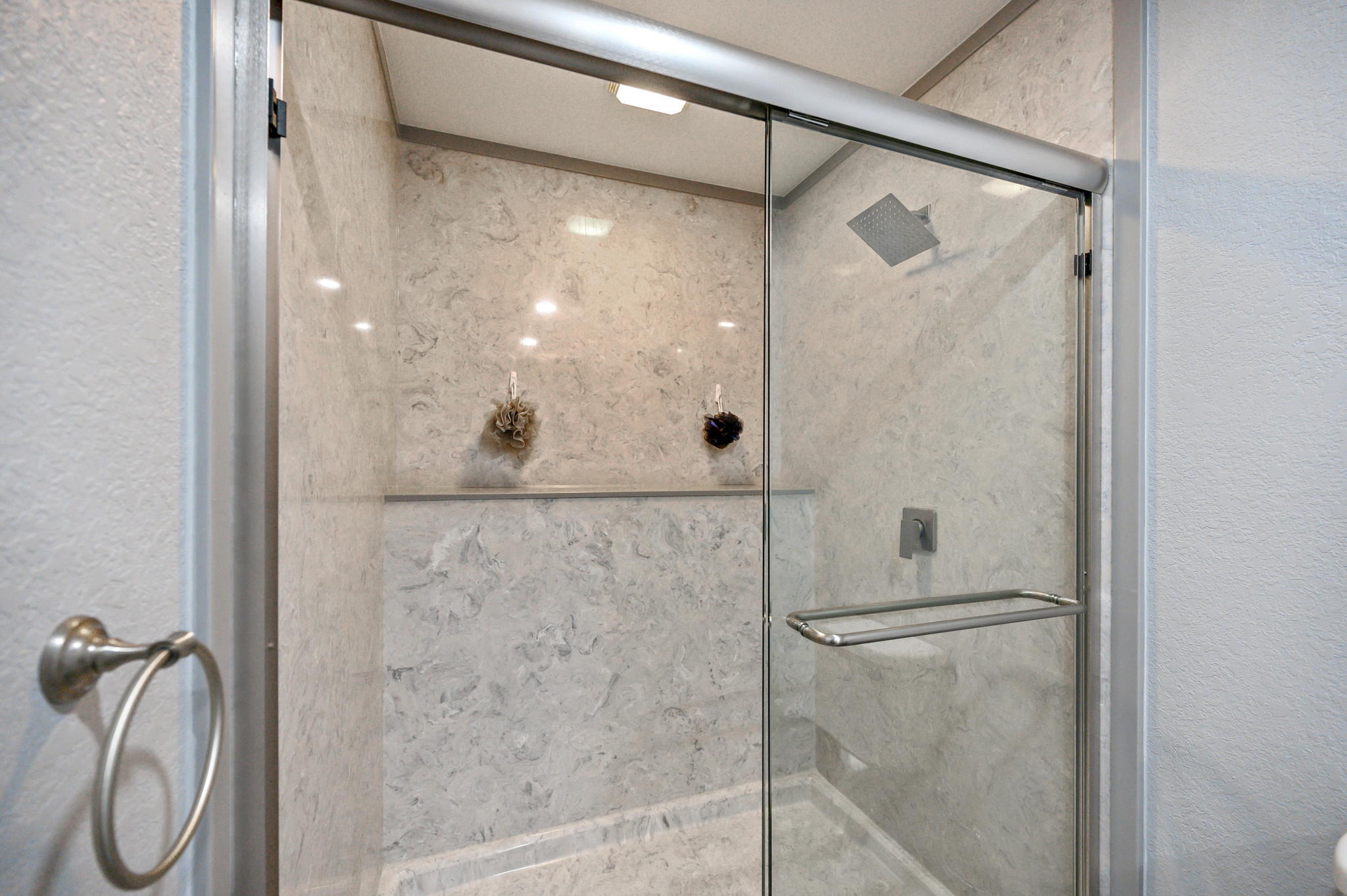 149 Delaware Road DeFuniak Springs, FL 32433 - Photo 18 of 36 a bathroom with a glass shower door
