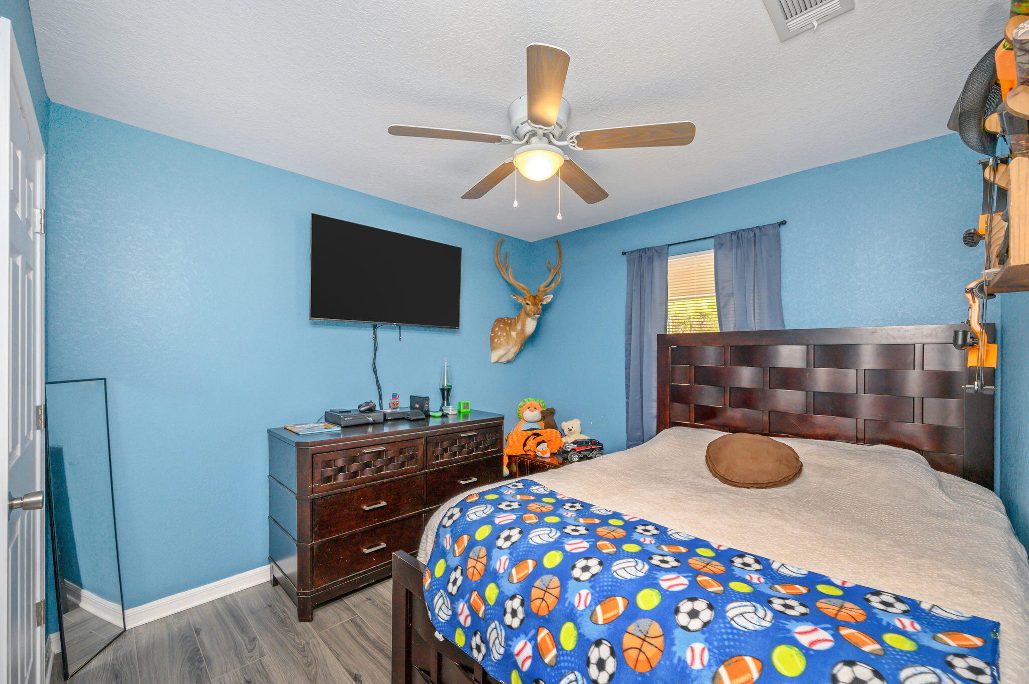 149 Delaware Road DeFuniak Springs, FL 32433 - Photo 23 of 36 a bedroom with a bed and a flat screen tv