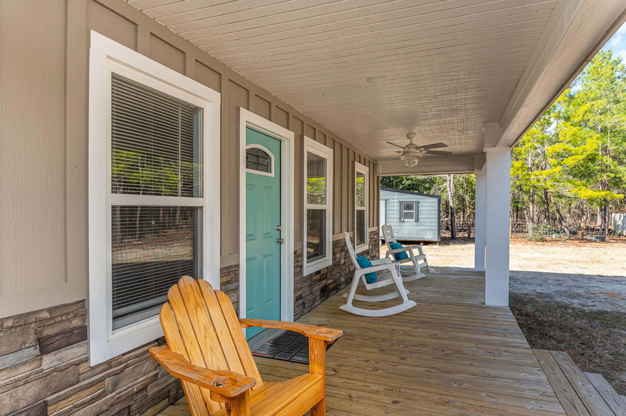 149 Delaware Road DeFuniak Springs, FL 32433 - Photo 6 of 36 a view of a patio with table and chairs and wooden floor