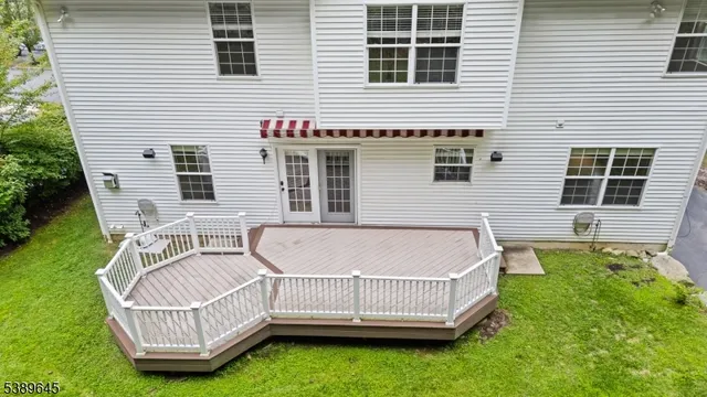 a view of a house with a chairs in the patio