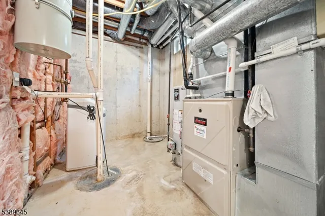 an aerial view of a house with a big yard and large trees