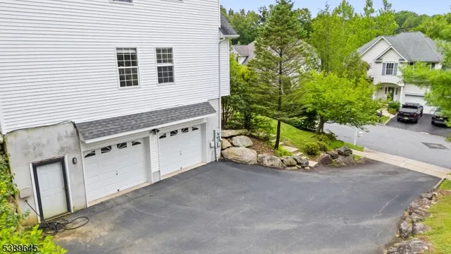an aerial view of a house with a backyard