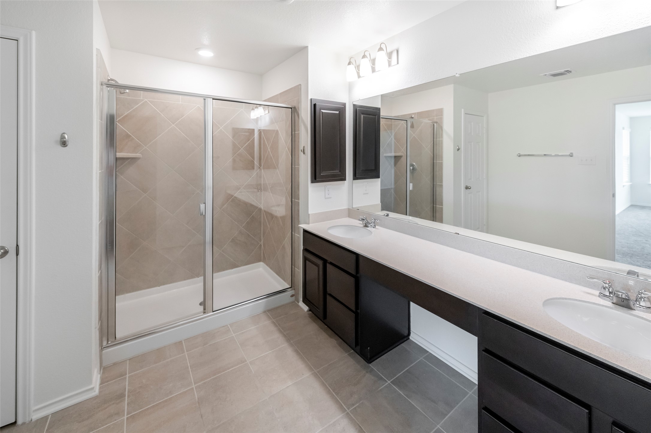 1101 Arbor Acres Loop Leander, TX 78641 - Photo 12 of 19 a bathroom with a double vanity sink mirror and shower