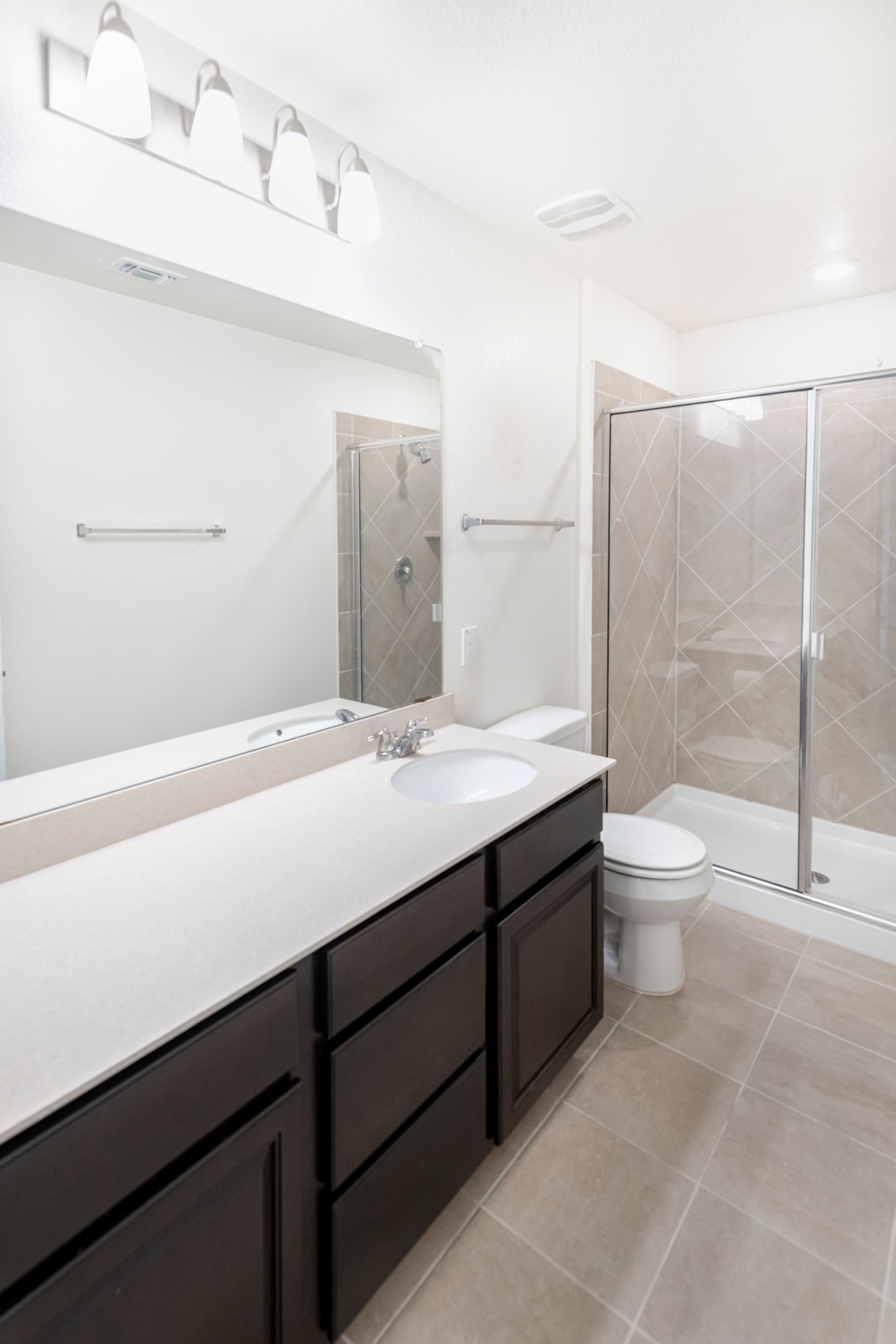 1101 Arbor Acres Loop Leander, TX 78641 - Photo 15 of 19 a bathroom with a double vanity sink toilet and shower