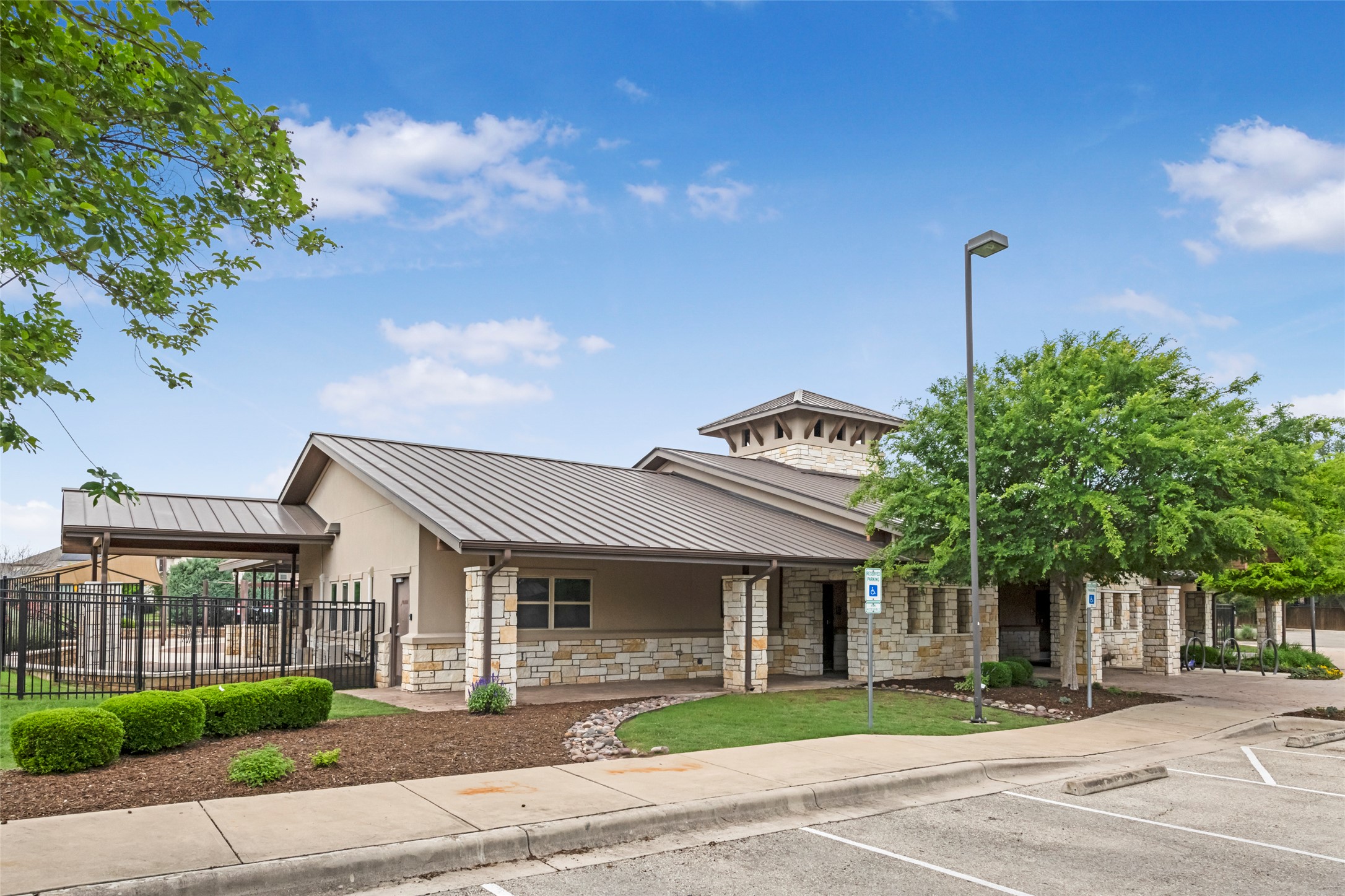 1101 Arbor Acres Loop Leander, TX 78641 - Photo 16 of 19 a front view of a house with a garden and plants