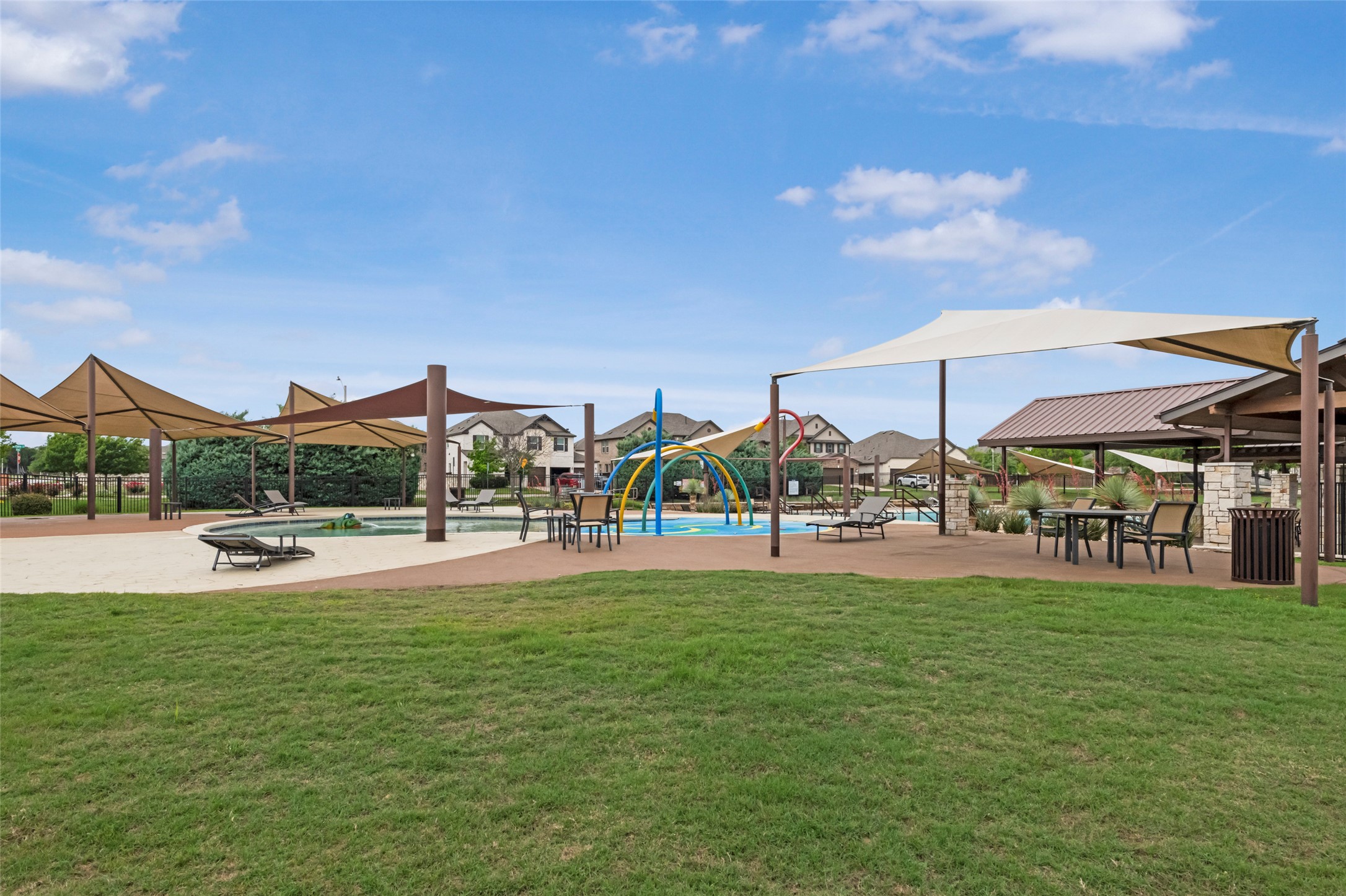 1101 Arbor Acres Loop Leander, TX 78641 - Photo 17 of 19 a view of a swimming pool with lawn chairs and a big yard