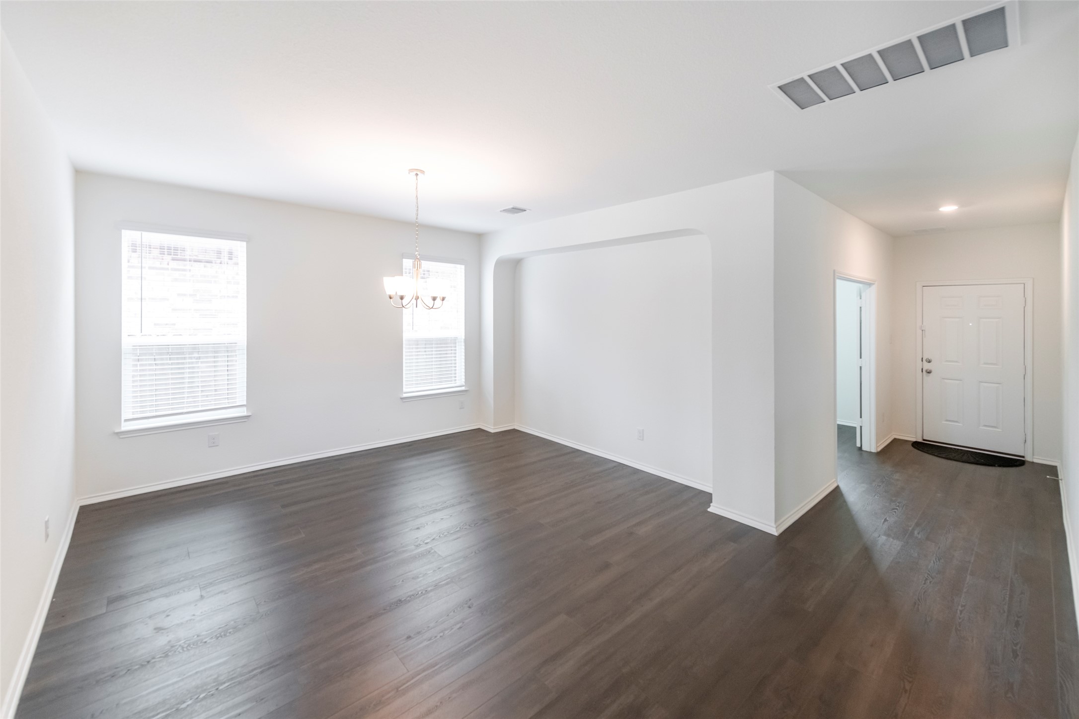 1101 Arbor Acres Loop Leander, TX 78641 - Photo 3 of 19 an empty room with wooden floor and windows