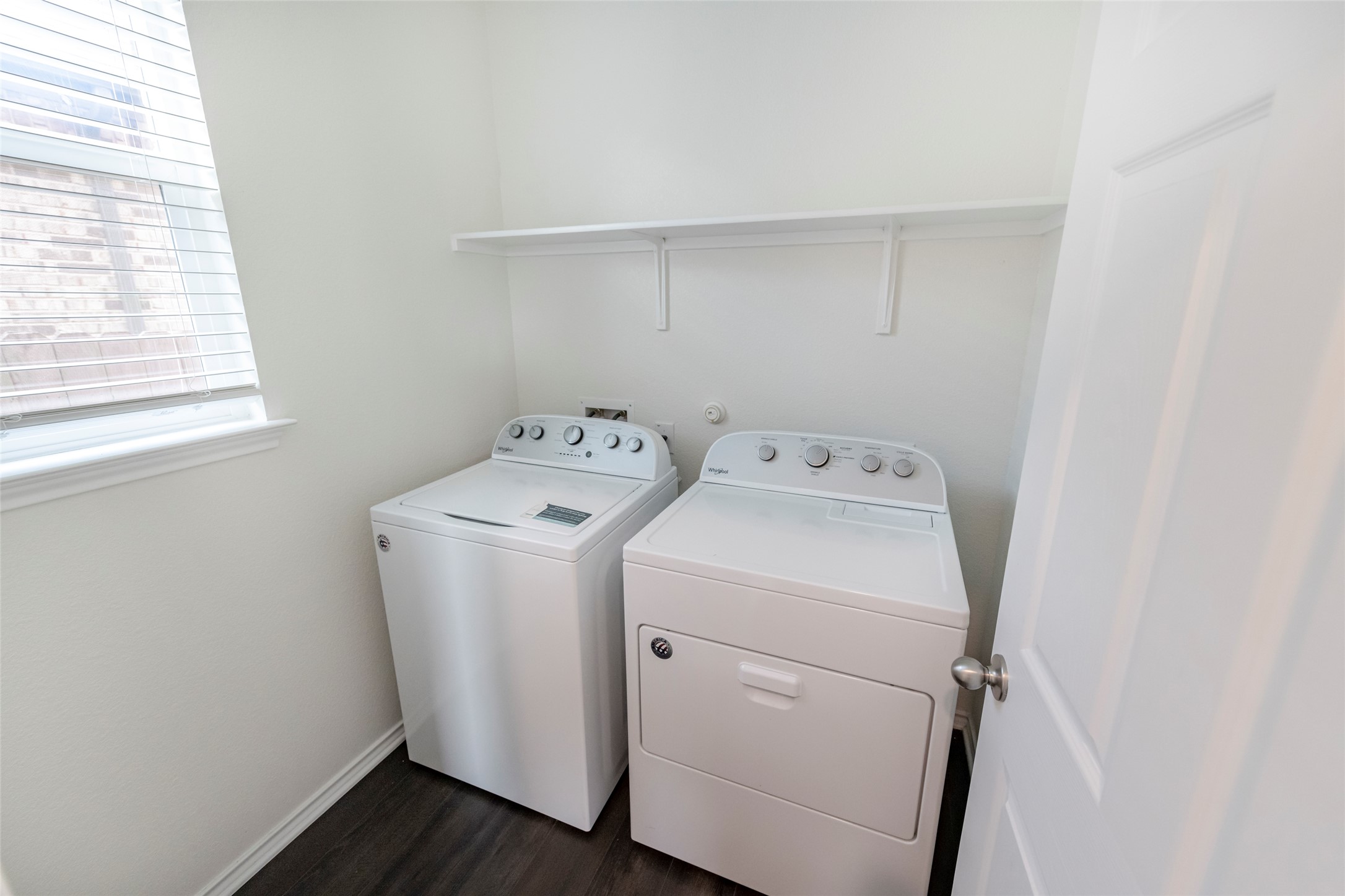 1101 Arbor Acres Loop Leander, TX 78641 - Photo 7 of 19 a utility room with dryer and washer