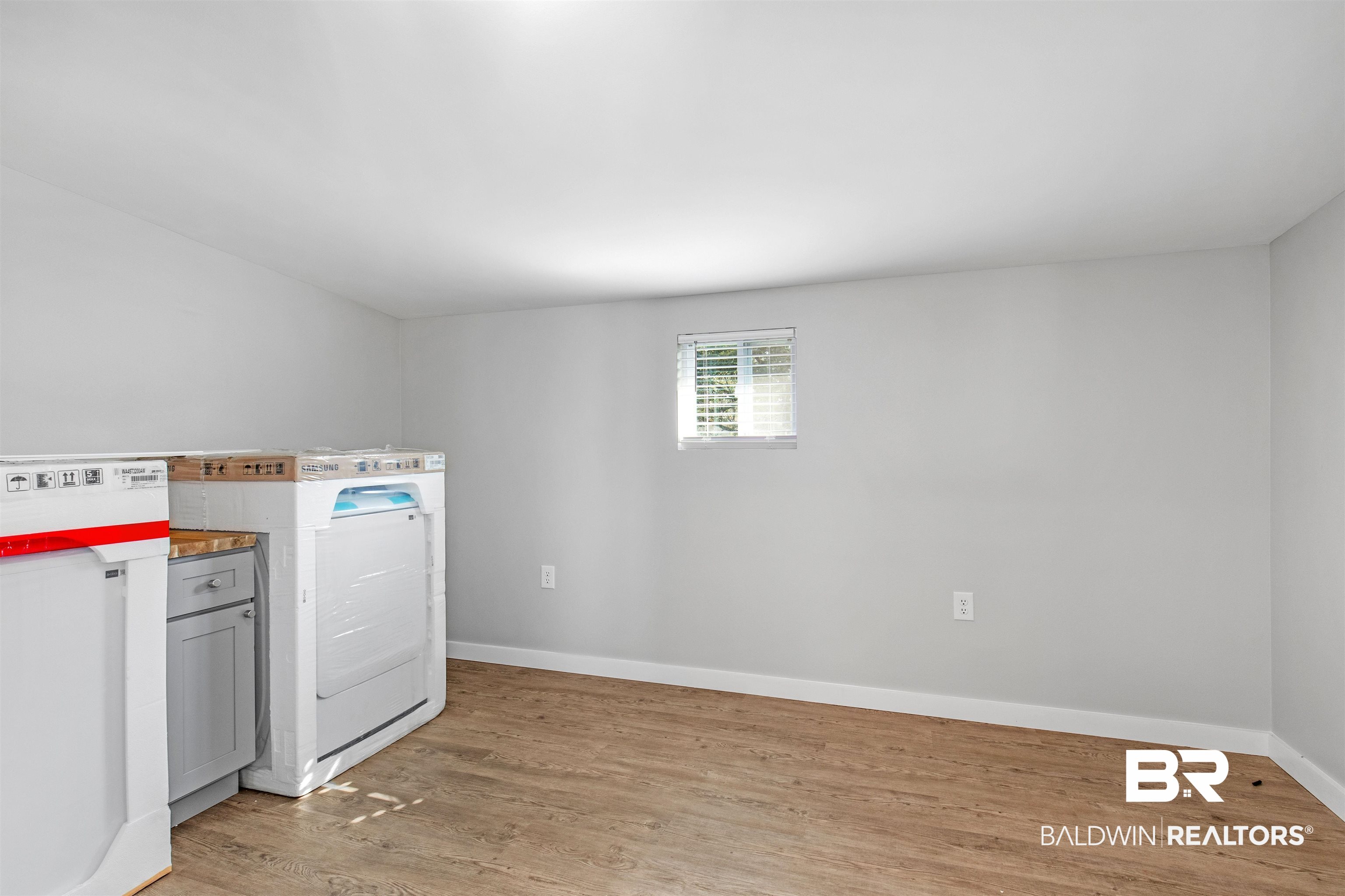 3005 Club House Road Mobile, AL 36605 - Photo 7 of 20 Laundry room with light wood-type flooring and washer / dryer