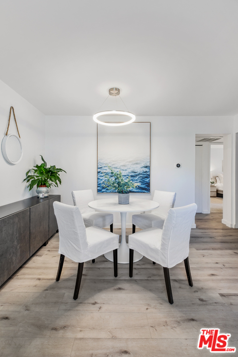 8303 Raintree Circle Culver City, CA 90230 - Photo 12 of 26 a workspace with furniture and a potted plant