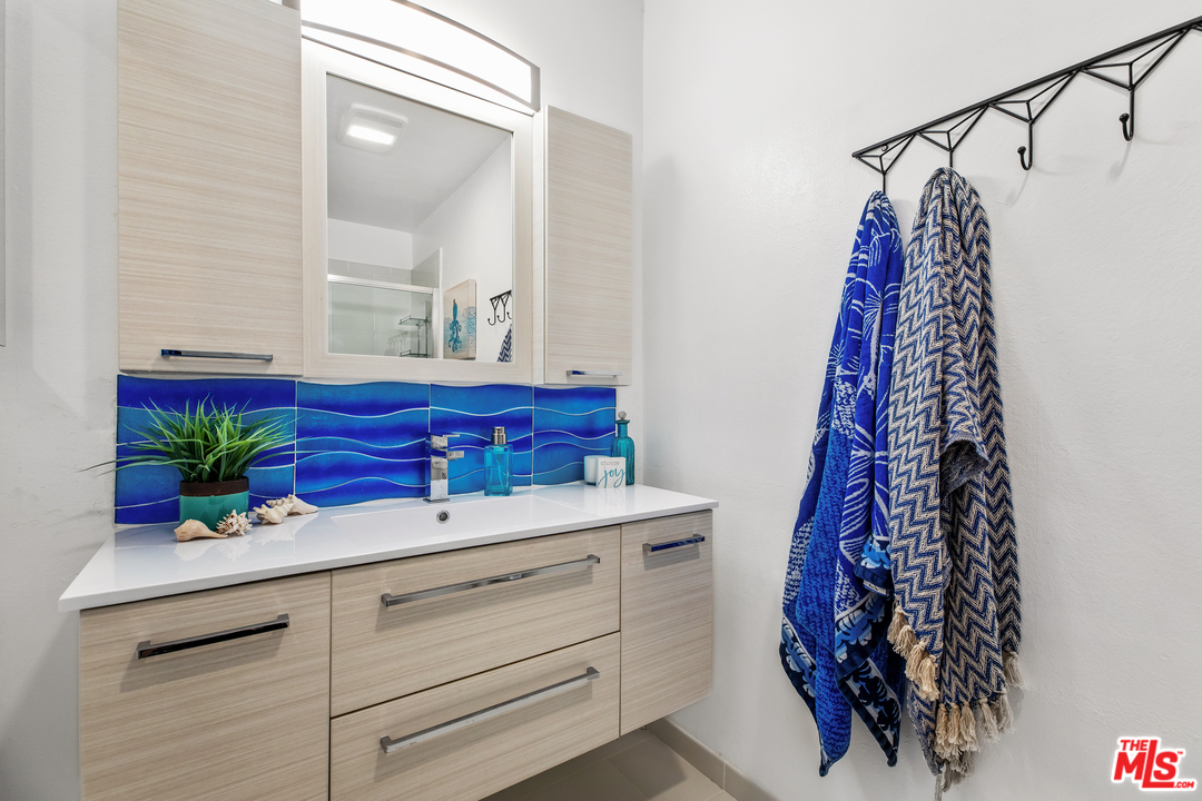 8303 Raintree Circle Culver City, CA 90230 - Photo 18 of 26 a bathroom with a bathtub and a shower