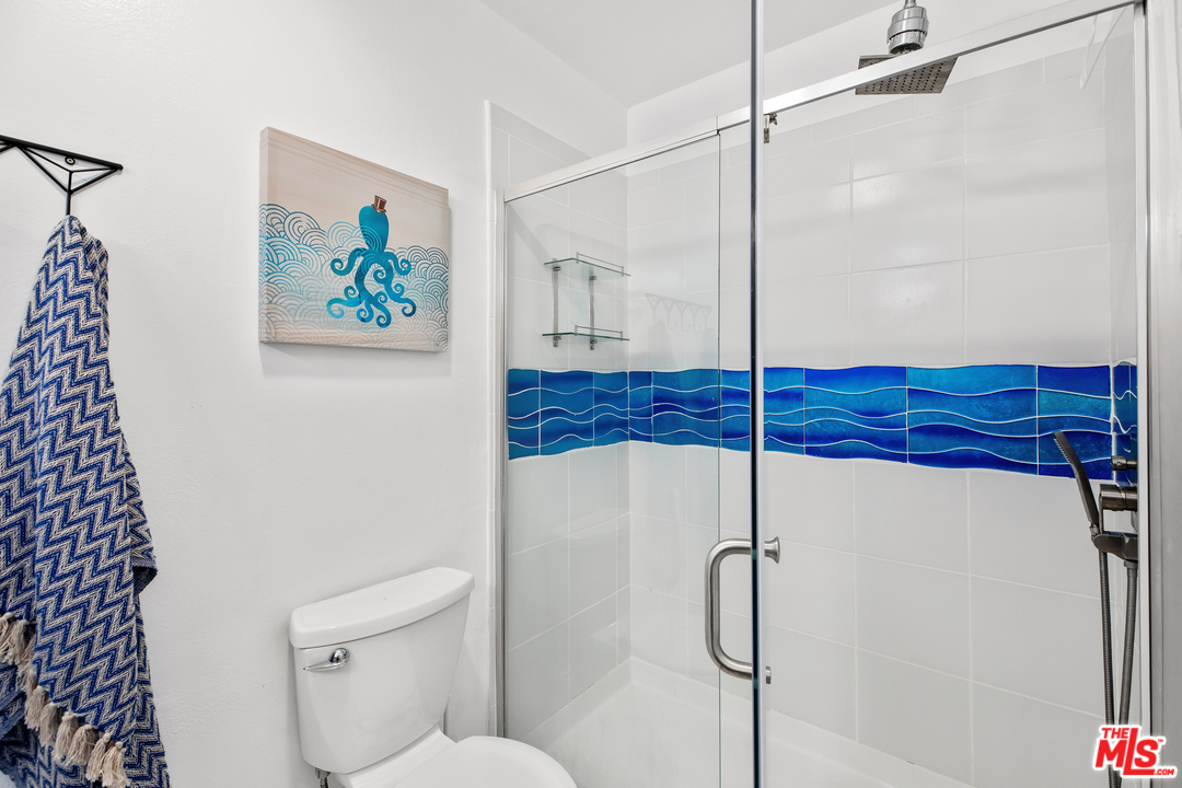 8303 Raintree Circle Culver City, CA 90230 - Photo 19 of 26 a bathroom with a shower and a toilet