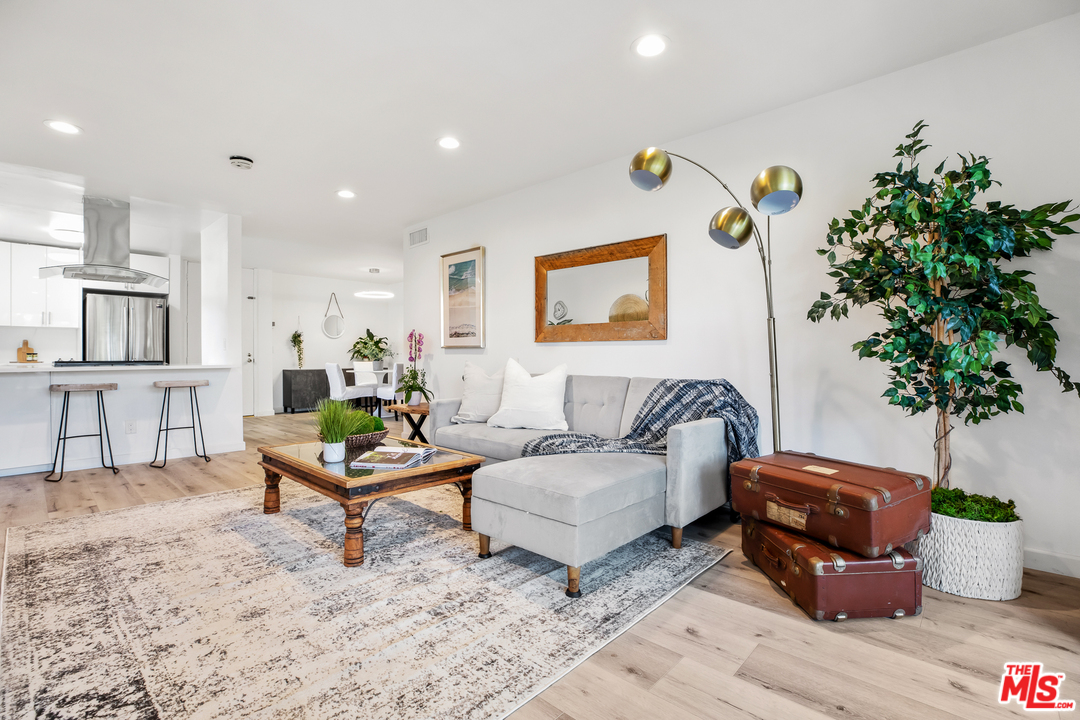 8303 Raintree Circle Culver City, CA 90230 - Photo 6 of 26 a living room with furniture and wooden floor