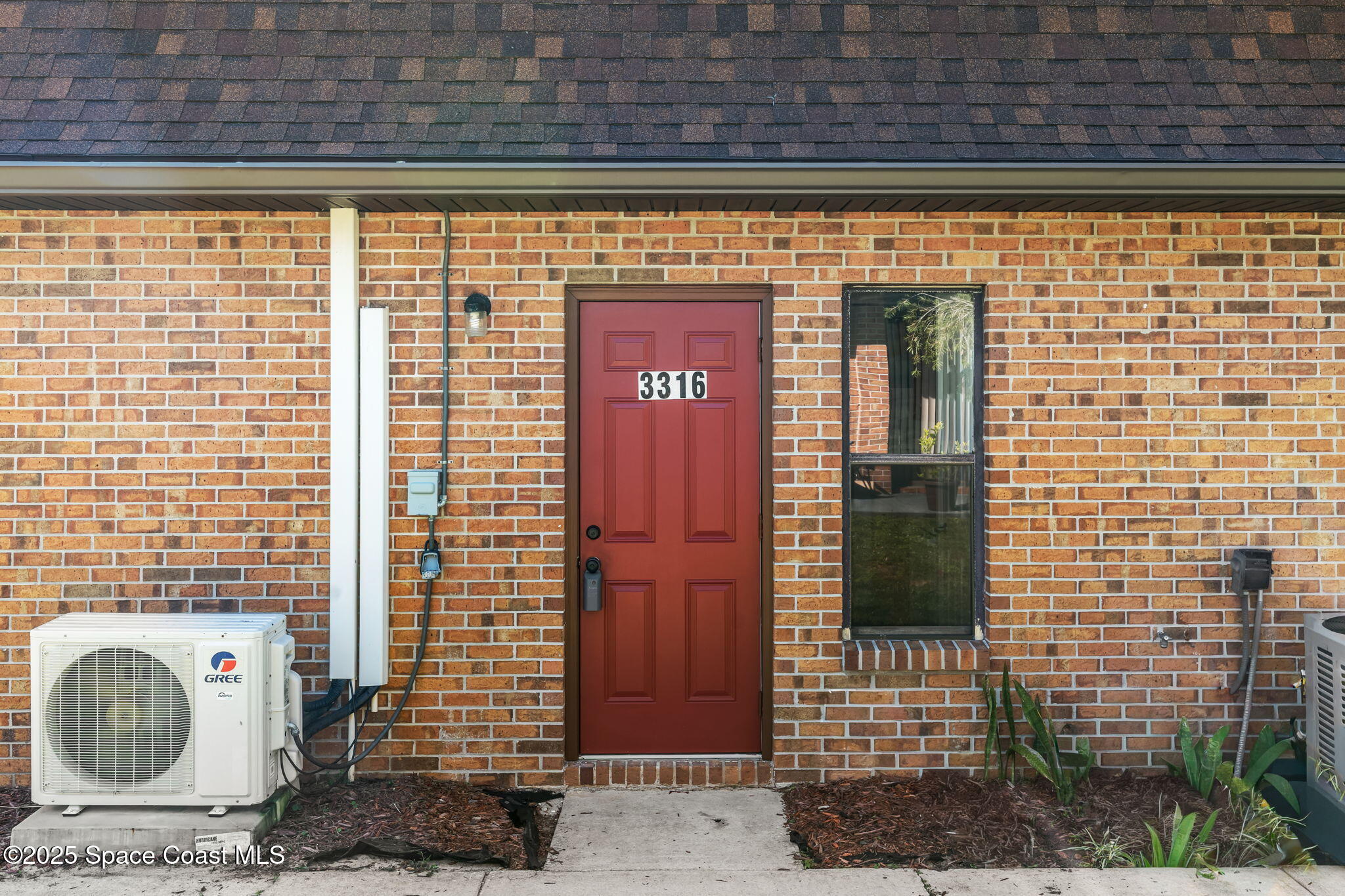 a front view of a building with a glass door