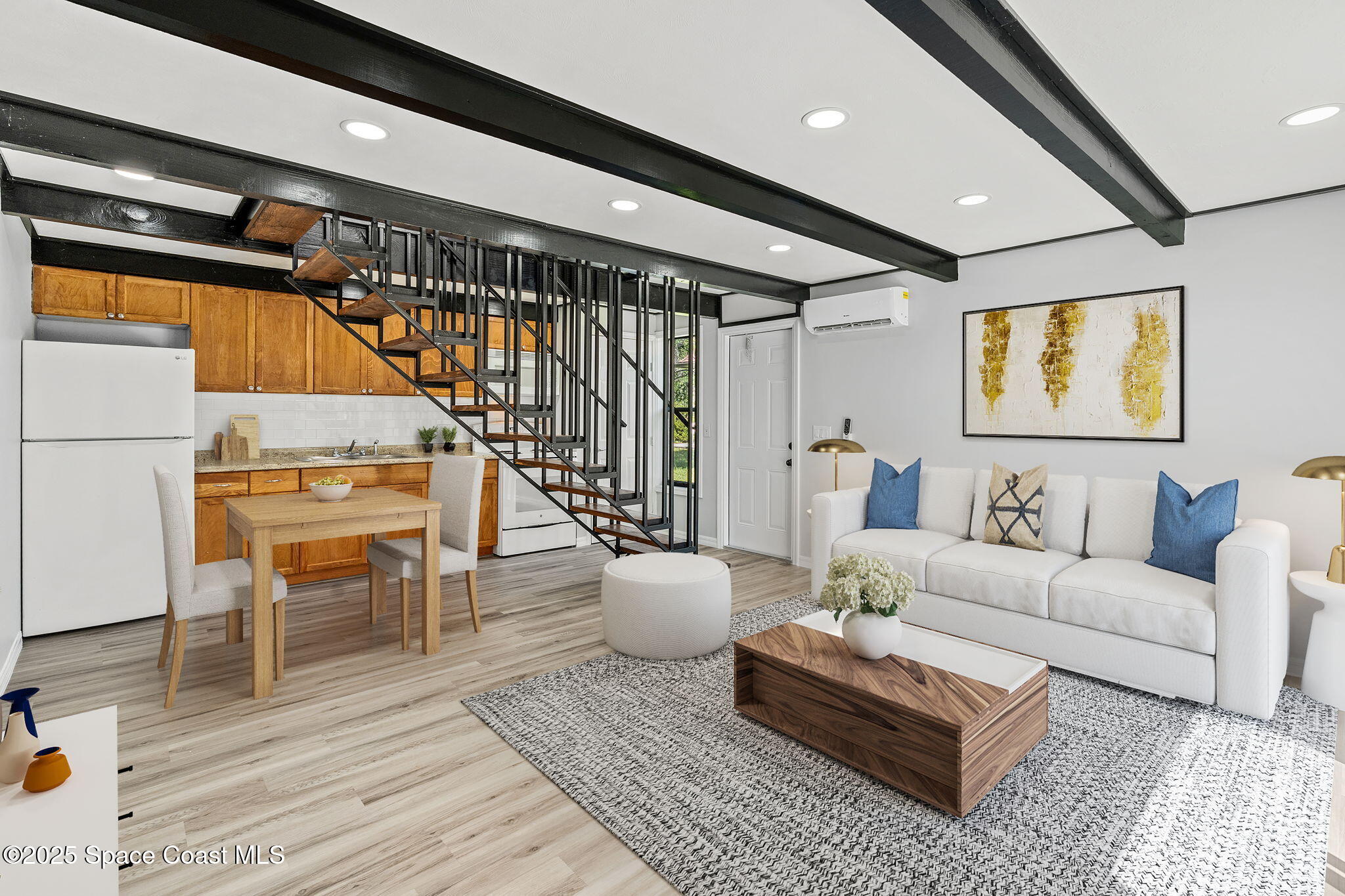 3316 Overlook Drive, Unit 62 Palm Bay, FL 32905 - Photo 6 of 23 a living room with furniture and wooden floor