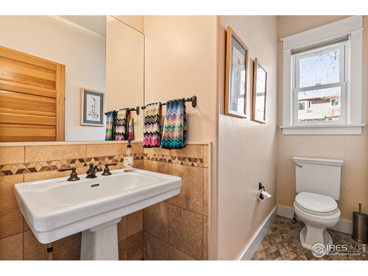 2853 14th Street Boulder, CO 80304 - Photo 16 of 40 a bathroom with a sink toilet and a mirror