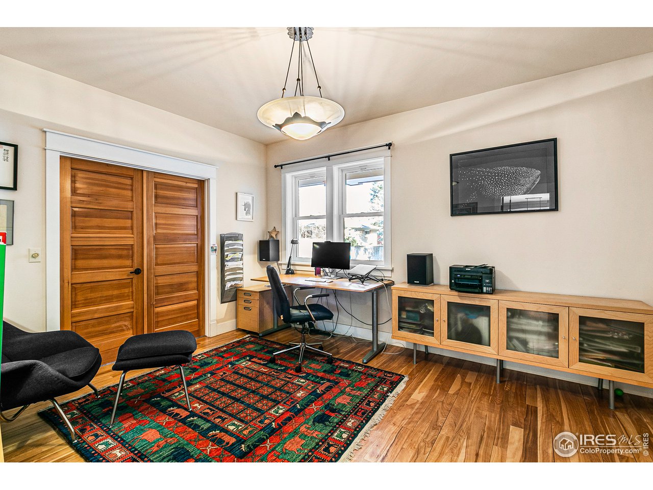 2853 14th Street Boulder, CO 80304 - Photo 17 of 40 a living room with furniture a flat screen tv and a table