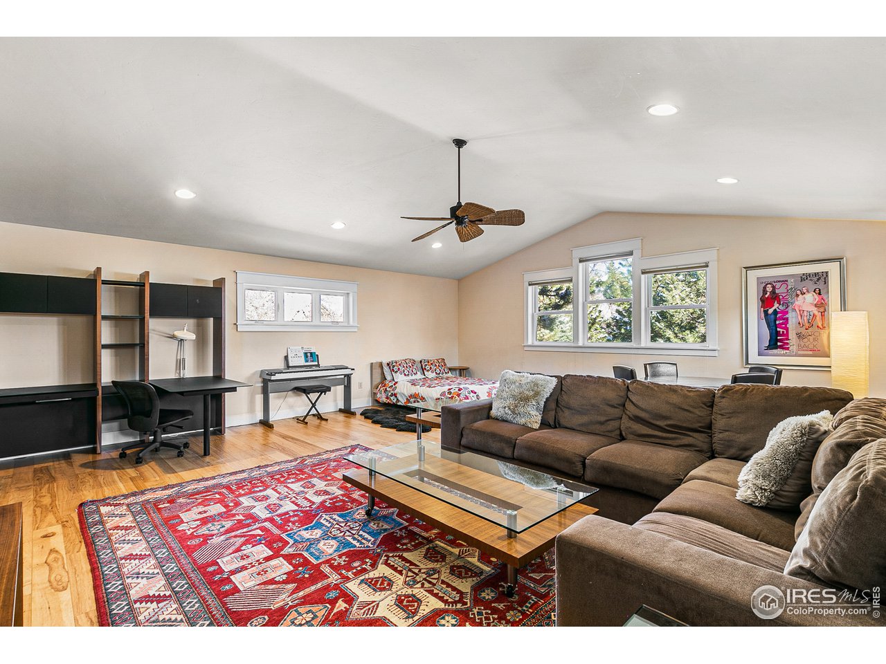 2853 14th Street Boulder, CO 80304 - Photo 19 of 40 a living room with furniture a rug and a flat screen tv