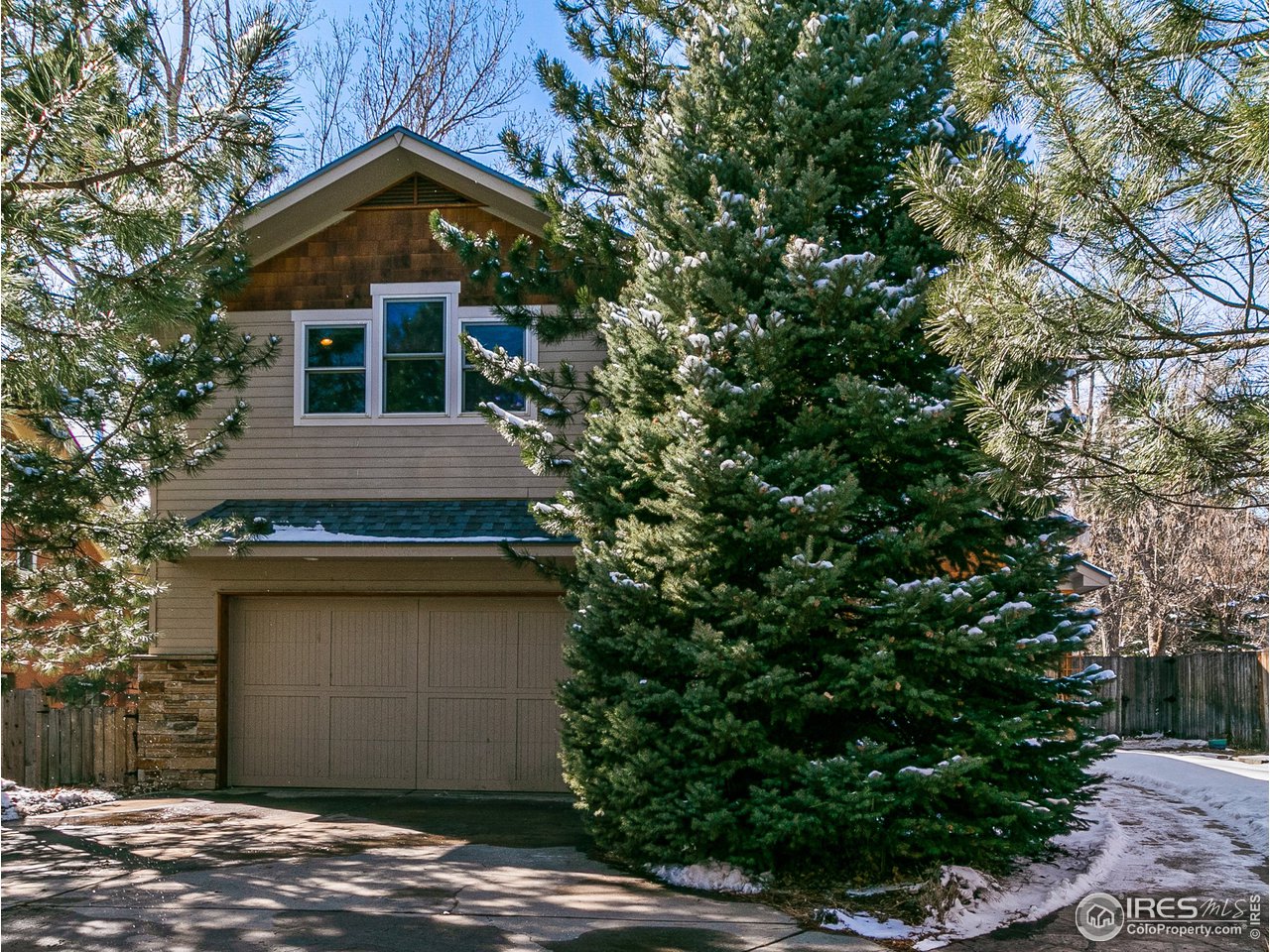 2853 14th Street Boulder, CO 80304 - Photo 2 of 40 a front view of a house with a yard