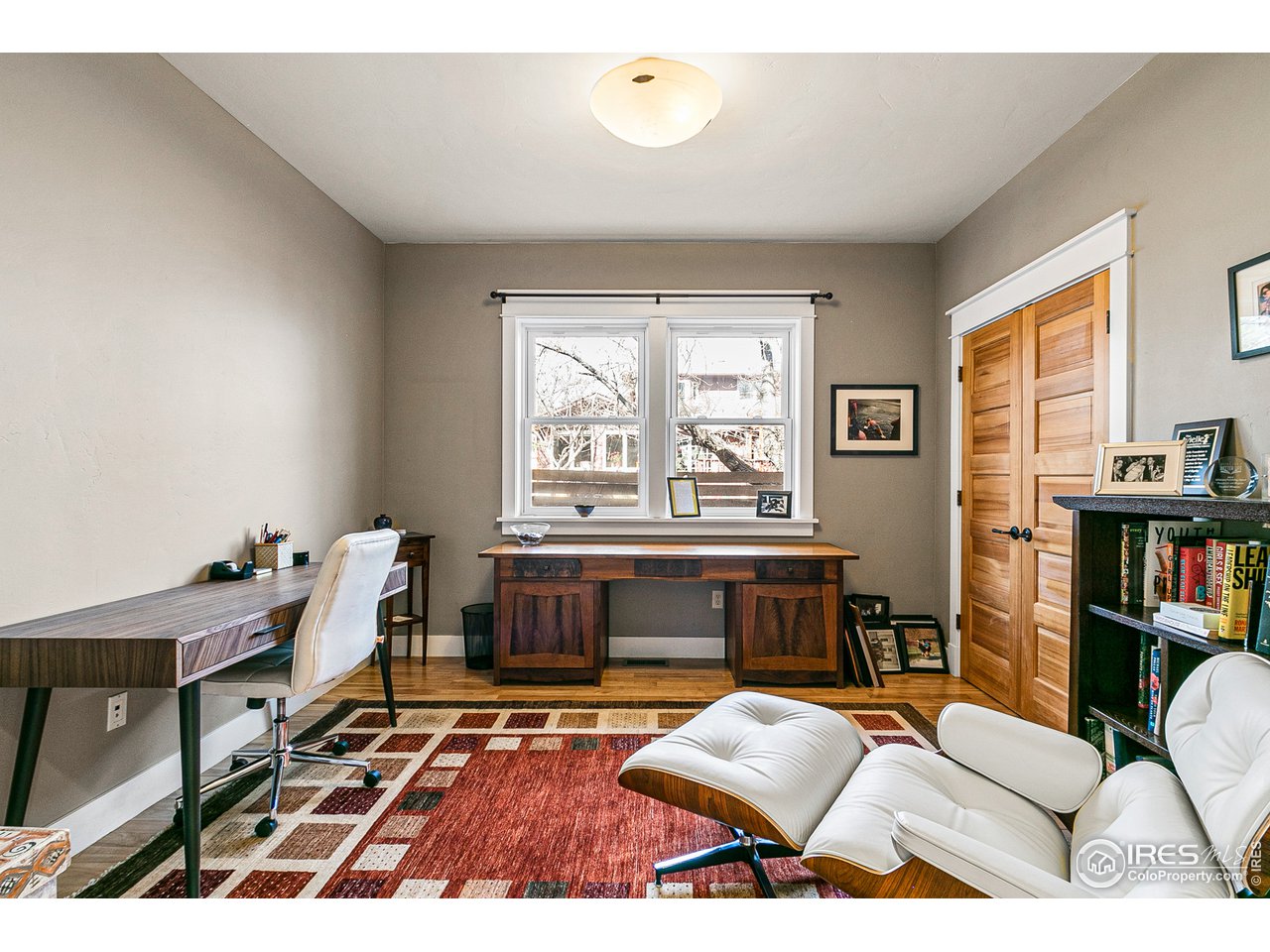2853 14th Street Boulder, CO 80304 - Photo 22 of 40 a living room with furniture and a wooden floor