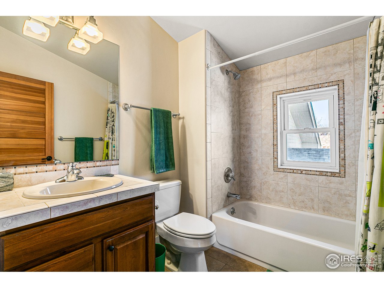 2853 14th Street Boulder, CO 80304 - Photo 23 of 40 a bathroom with a sink a toilet a mirror and bathtub