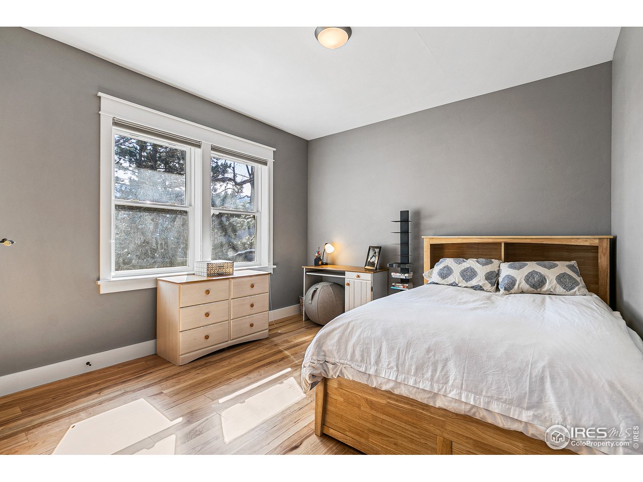 2853 14th Street Boulder, CO 80304 - Photo 36 of 40 a bedroom with a bed and large windows