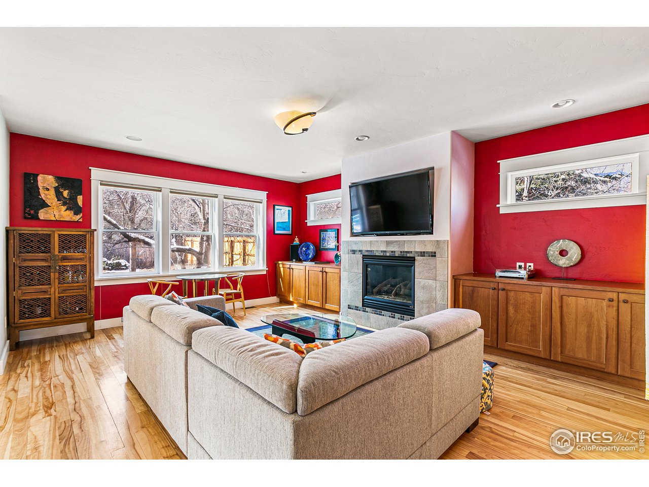 2853 14th Street Boulder, CO 80304 - Photo 6 of 40 a living room with furniture a flat screen tv and a fireplace