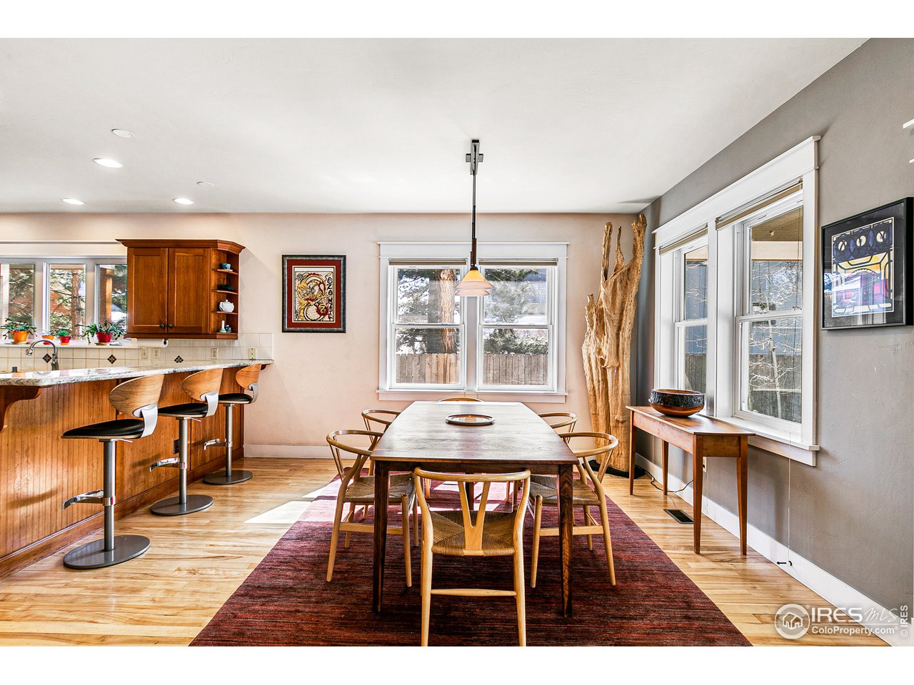 2853 14th Street Boulder, CO 80304 - Photo 8 of 40 a dining room with furniture window and wooden floor