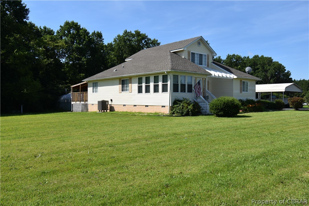151 Thomas Landing Road Lancaster, VA 22503 - Photo 6 of 39 a front view of a house with a garden