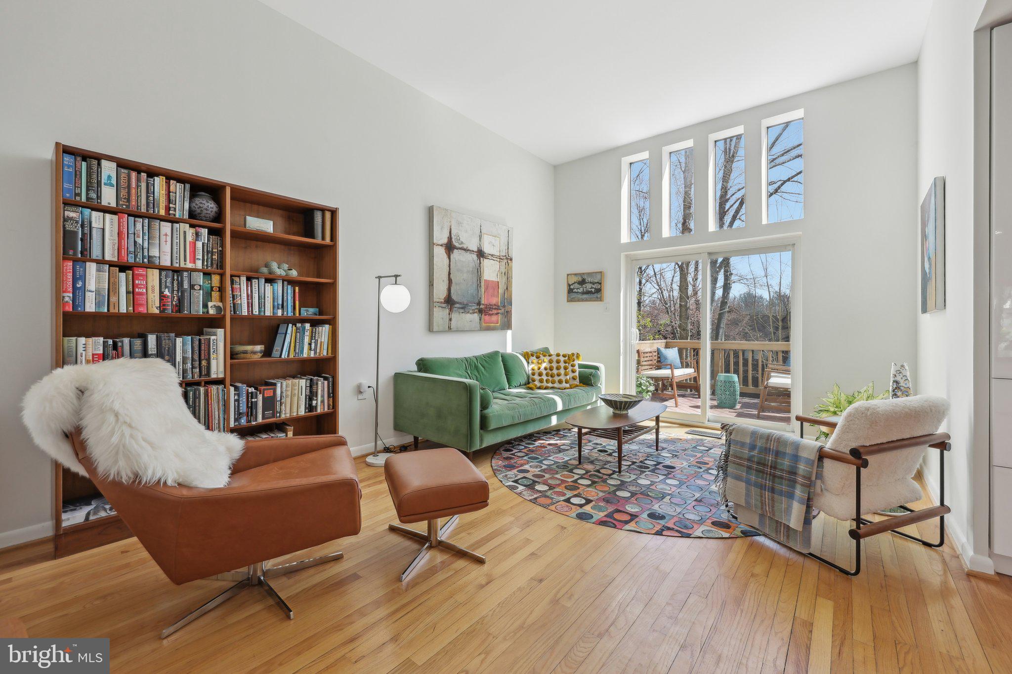 1503 Inlet Court Reston, VA 20190 - Photo 1 of 59 a living room with furniture and a book shelf