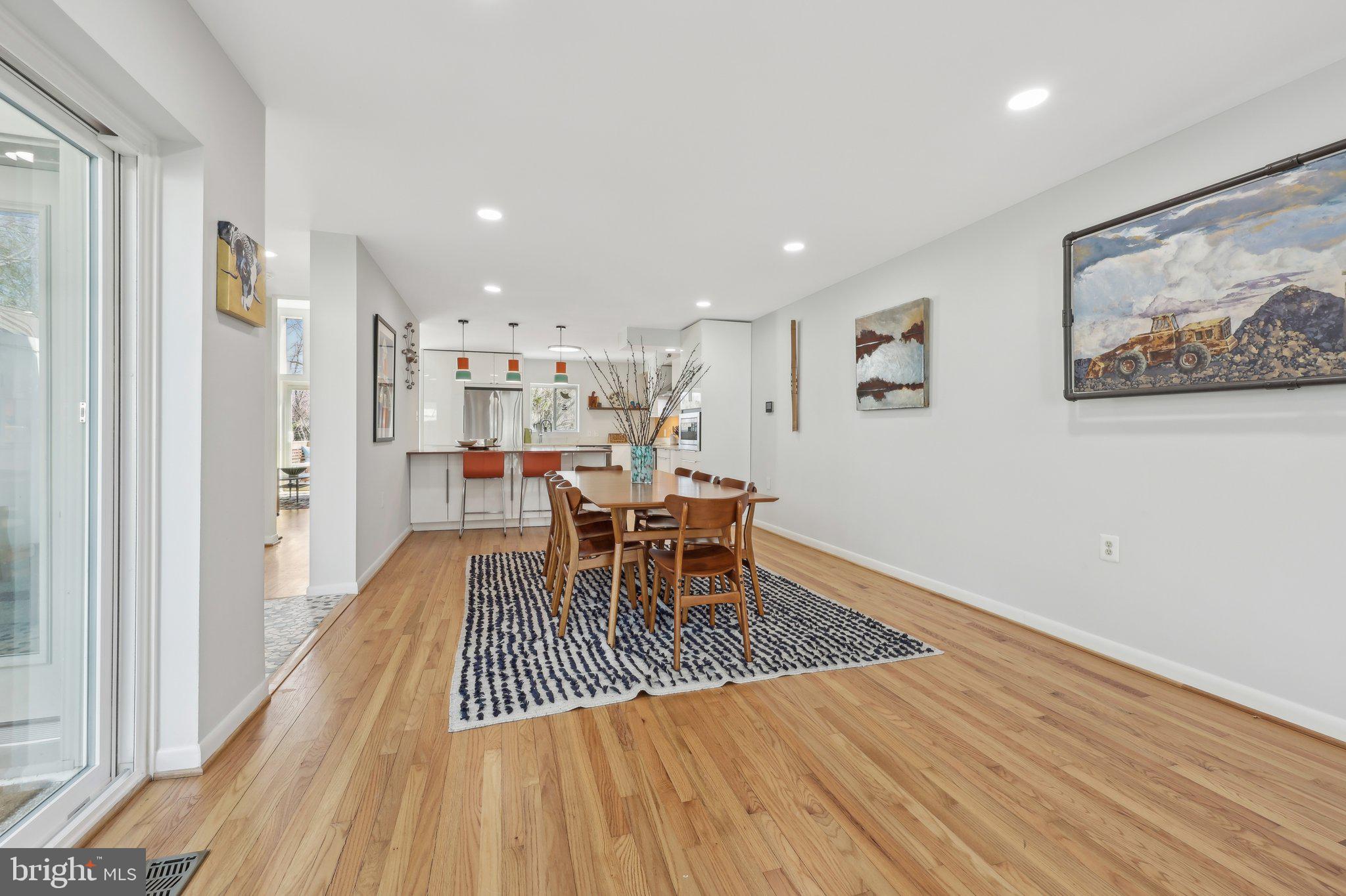 1503 Inlet Court Reston, VA 20190 - Photo 11 of 59 a dining room with wooden floor and a rug
