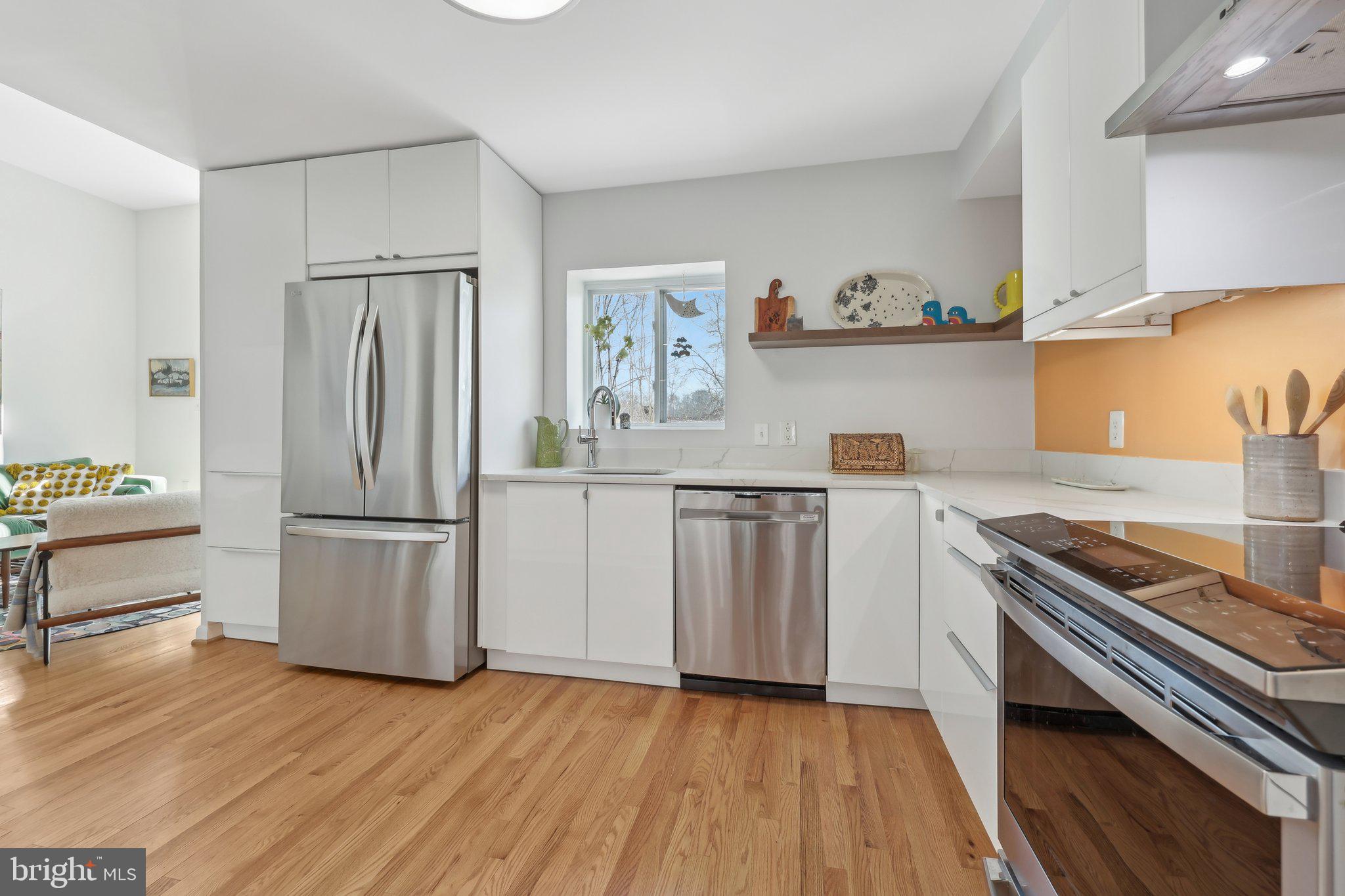 1503 Inlet Court Reston, VA 20190 - Photo 17 of 59 a kitchen with a refrigerator and a stove