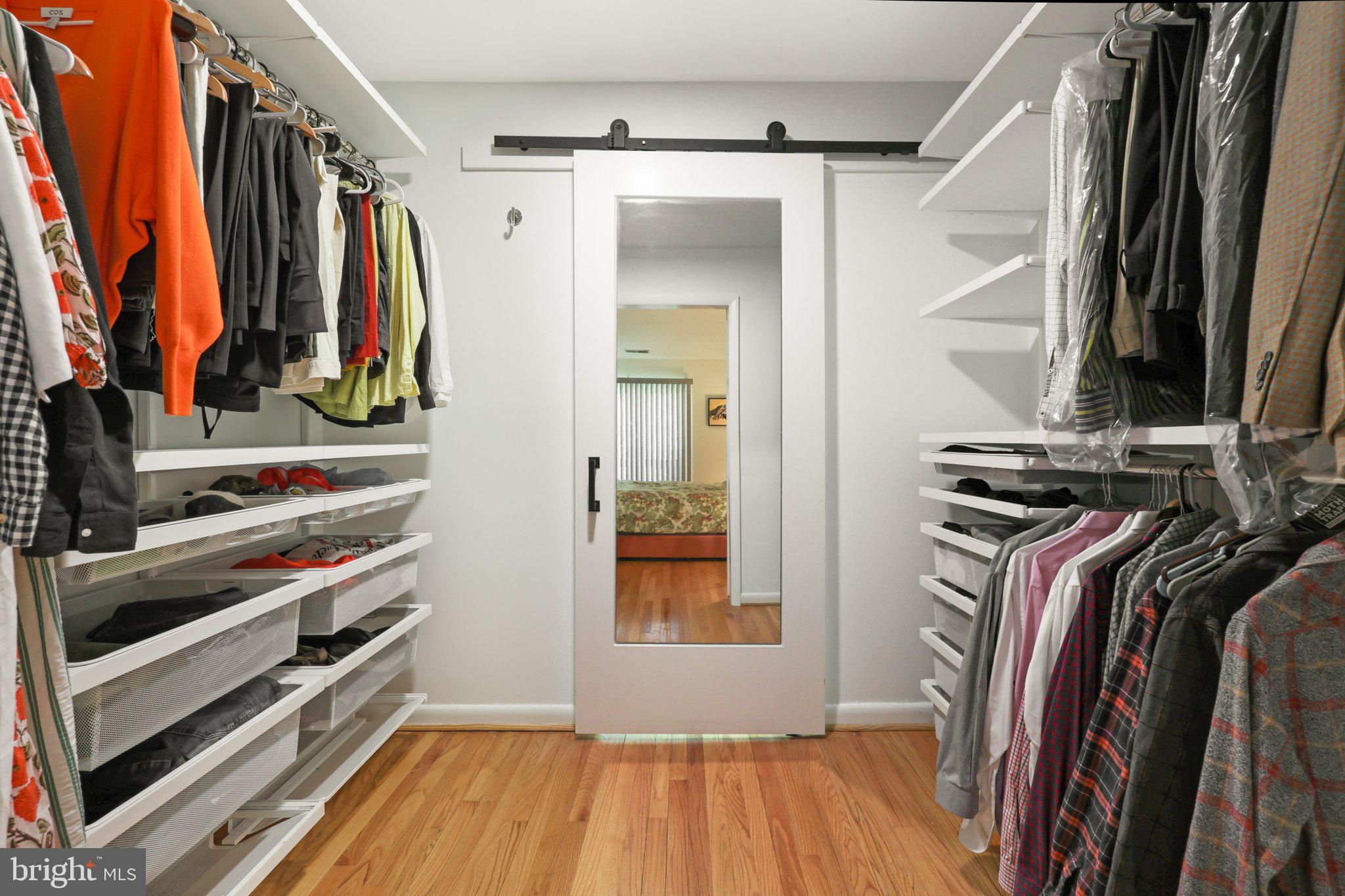 1503 Inlet Court Reston, VA 20190 - Photo 23 of 59 a view of walk in closet with clothes and shoes
