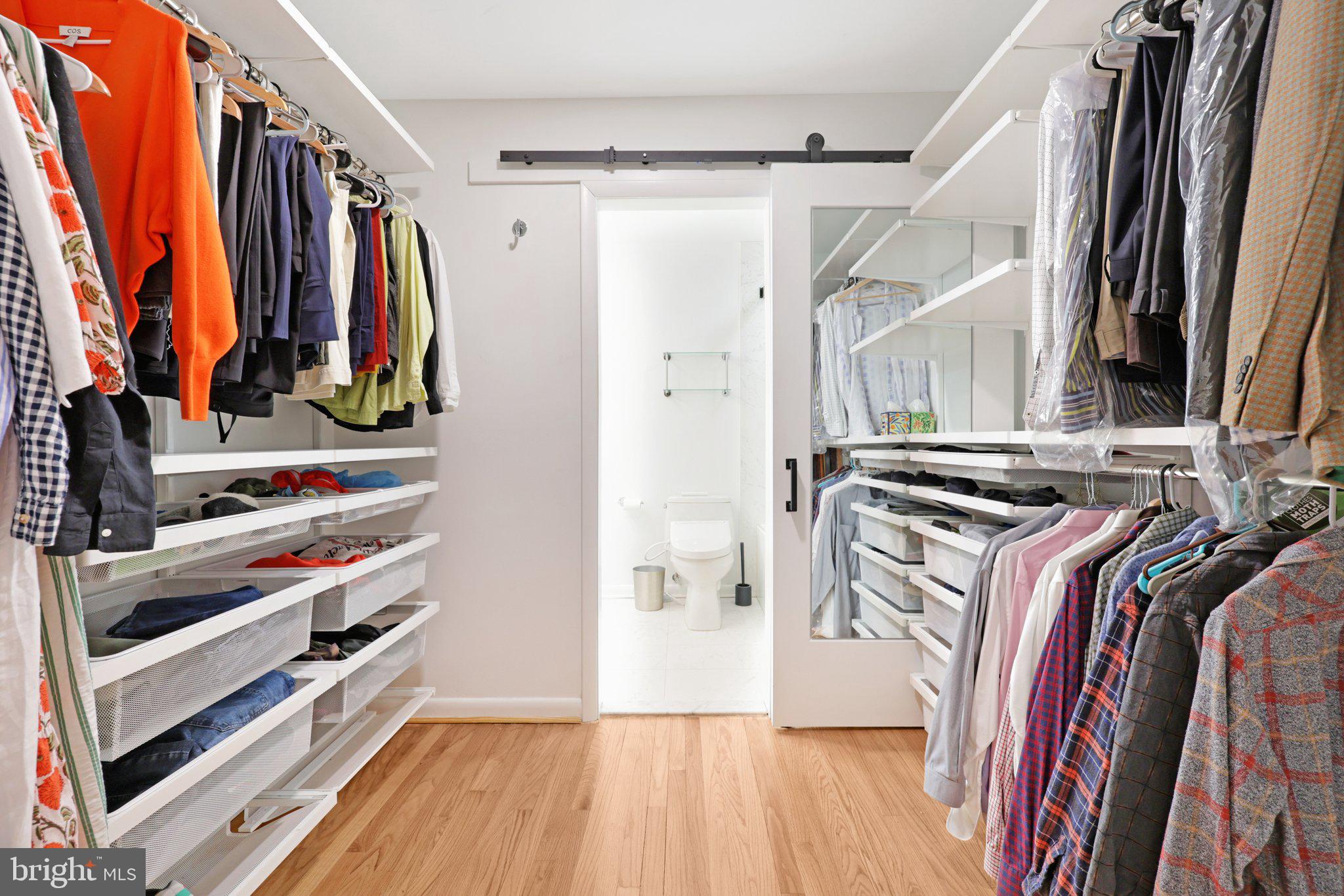 1503 Inlet Court Reston, VA 20190 - Photo 24 of 59 a view of walk in closet with clothes and shoes