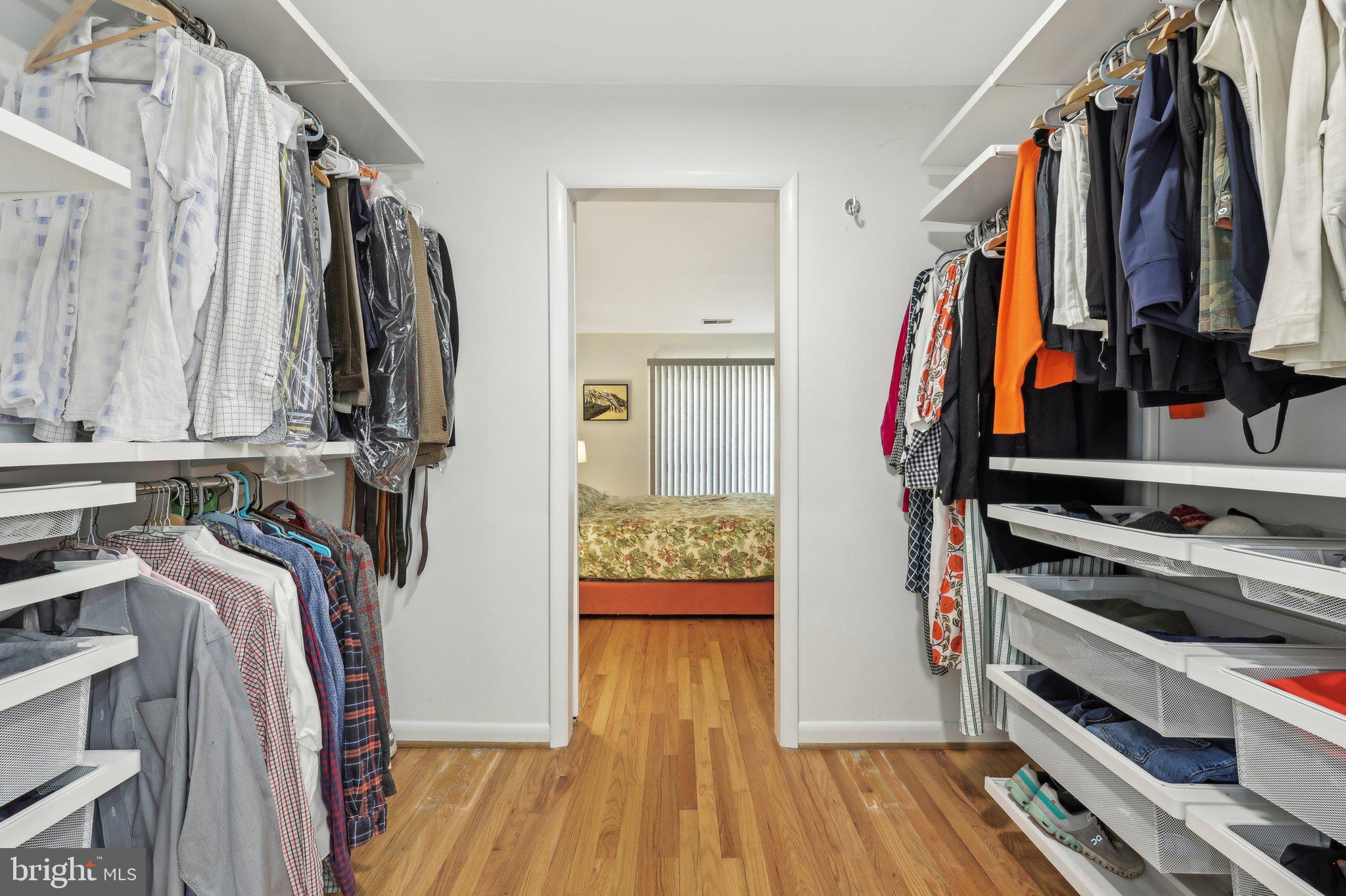 1503 Inlet Court Reston, VA 20190 - Photo 28 of 59 a view of walk in closet with clothes and shoes