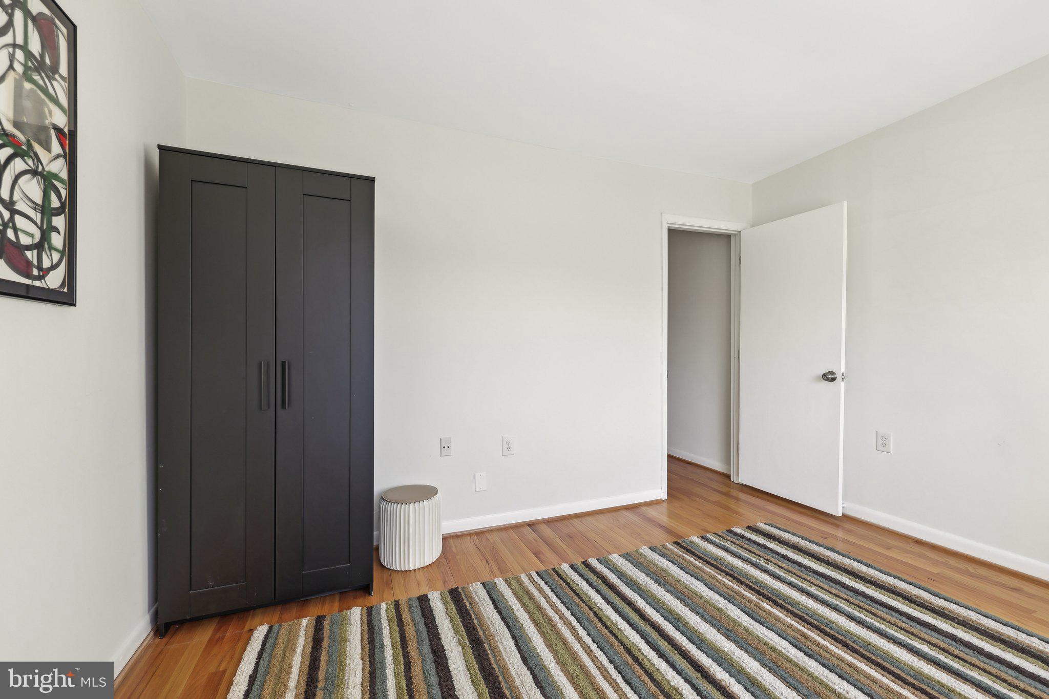 1503 Inlet Court Reston, VA 20190 - Photo 31 of 59 a view of an empty room with wooden floor and closet