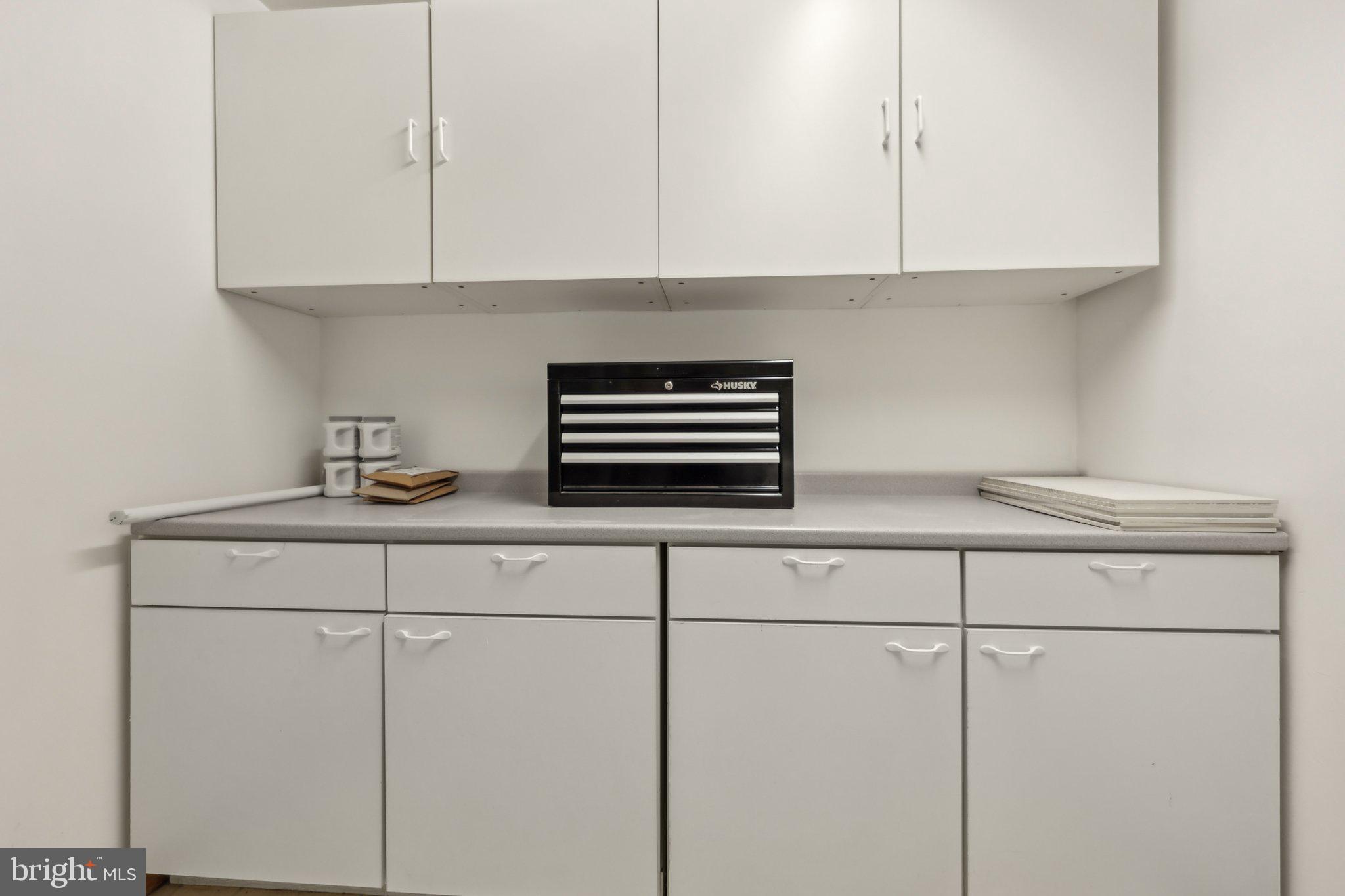 1503 Inlet Court Reston, VA 20190 - Photo 38 of 59 a kitchen with a sink and cabinets