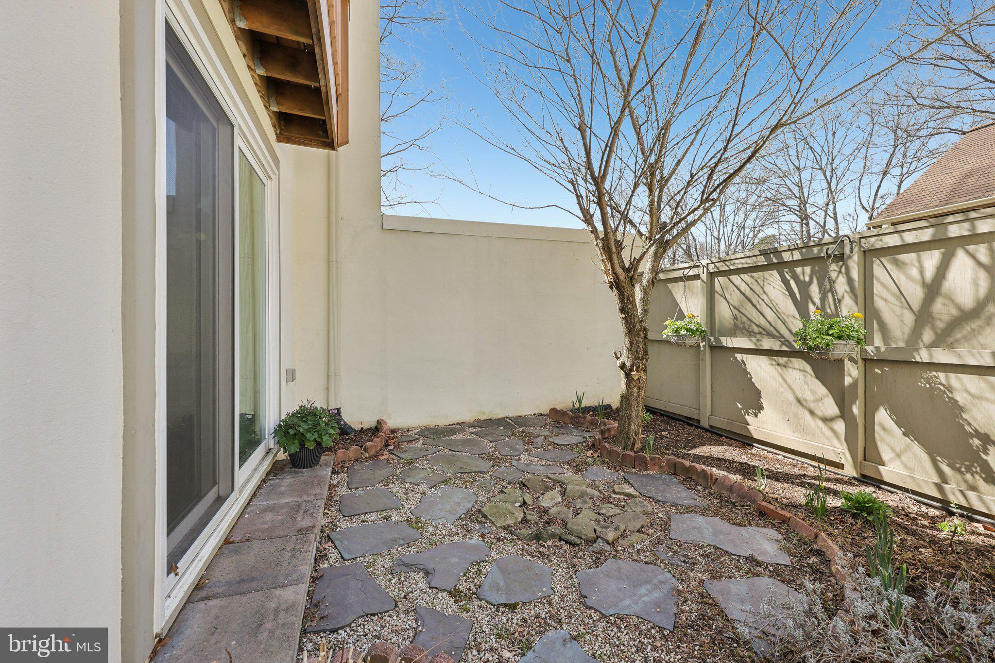 1503 Inlet Court Reston, VA 20190 - Photo 47 of 59 a view of a backyard with potted plants