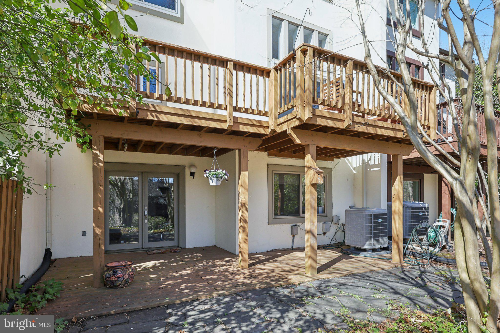 1503 Inlet Court Reston, VA 20190 - Photo 48 of 59 a view of a building with a bench in a patio
