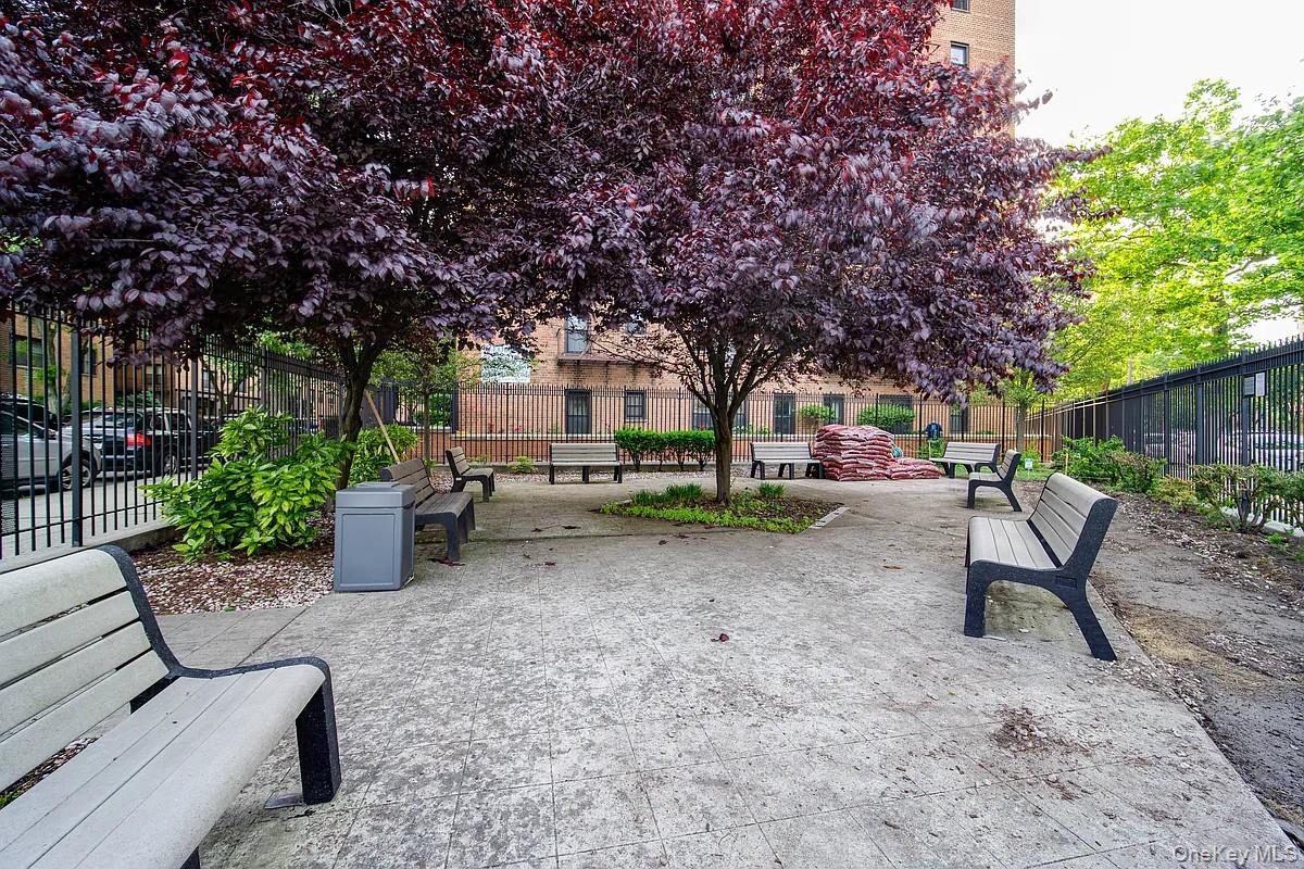 99-05 59th Avenue, Unit 2A Queens, NY 11368 - Photo 11 of 14 a view of a backyard with sitting area