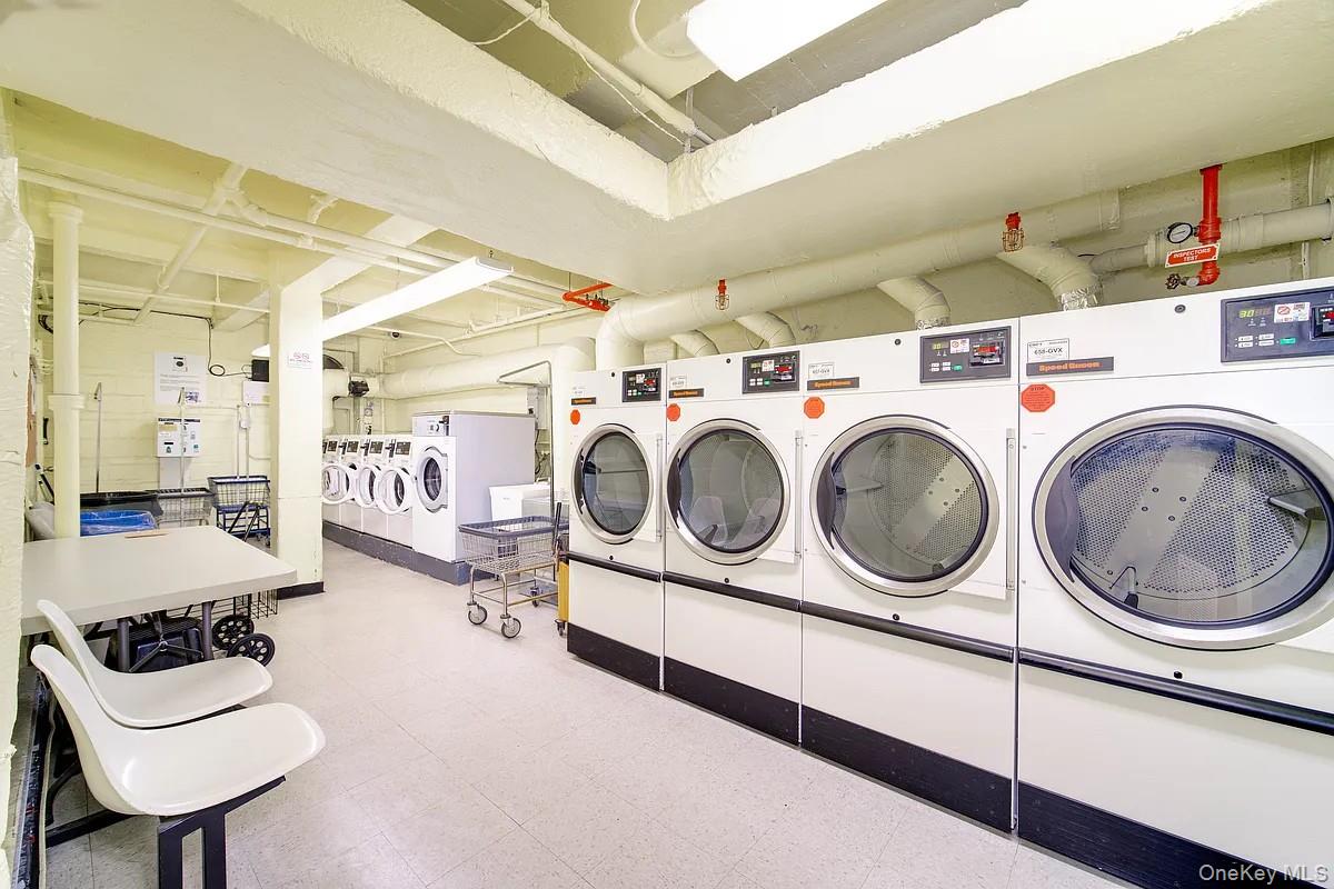 99-05 59th Avenue, Unit 2A Queens, NY 11368 - Photo 12 of 14 a utility room with dryer and washer