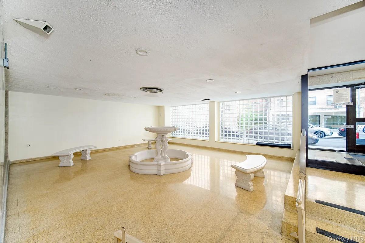 99-05 59th Avenue, Unit 2A Queens, NY 11368 - Photo 13 of 14 a view of a room with wooden floor