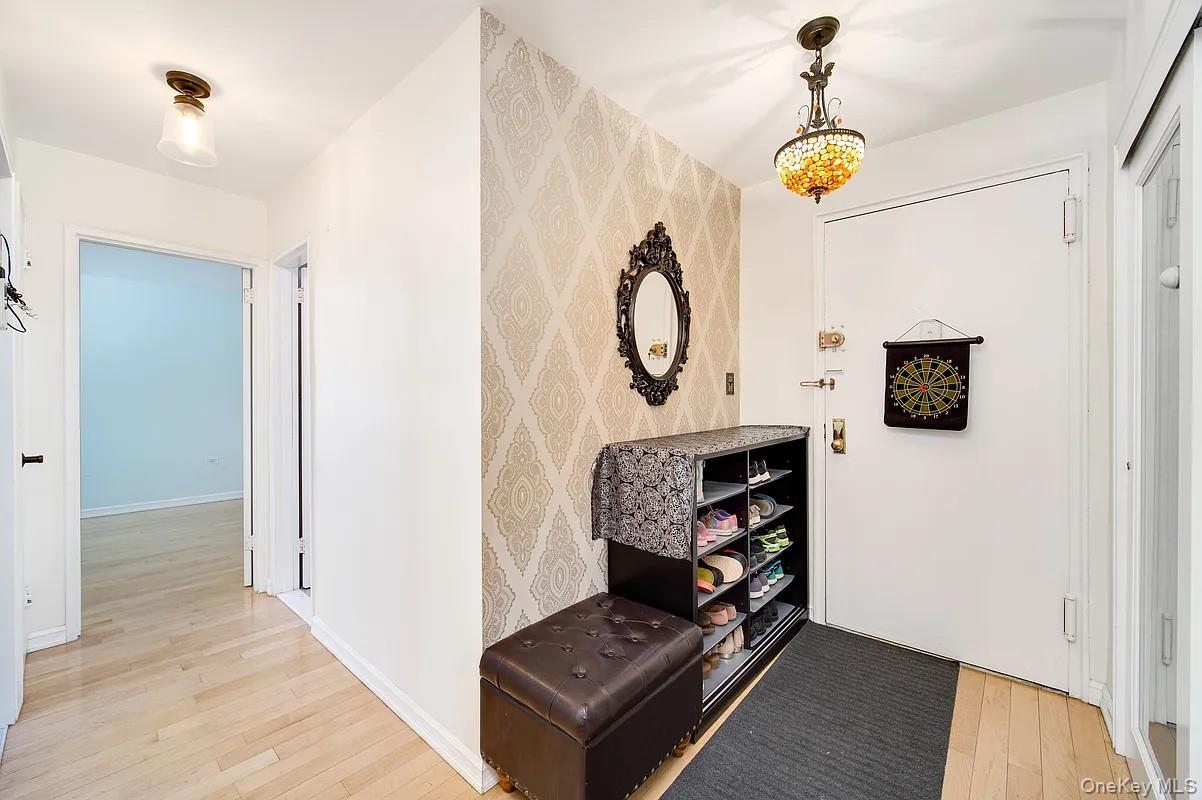 99-05 59th Avenue, Unit 2A Queens, NY 11368 - Photo 2 of 14 a view of an entryway with wooden floor
