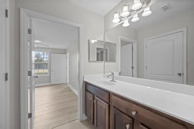 a bath room with a toilet and a bath tub