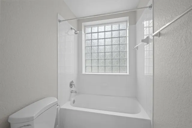 a bathroom with a sink a light fixture and a mirror