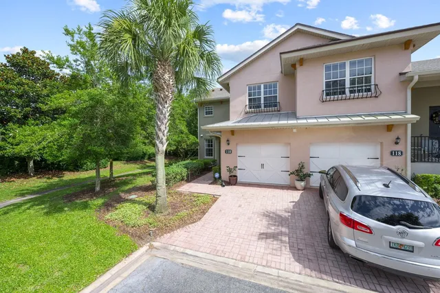 a view of a car parked in front of a house